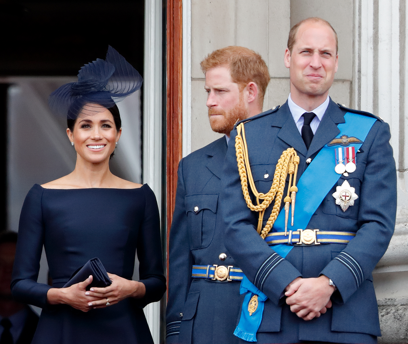 Meghan Markle, Prince Harry and Prince William watch a flypast from the balcony of Buckingham Palace on July 10, 2018, in London, England. | Source: Getty Images