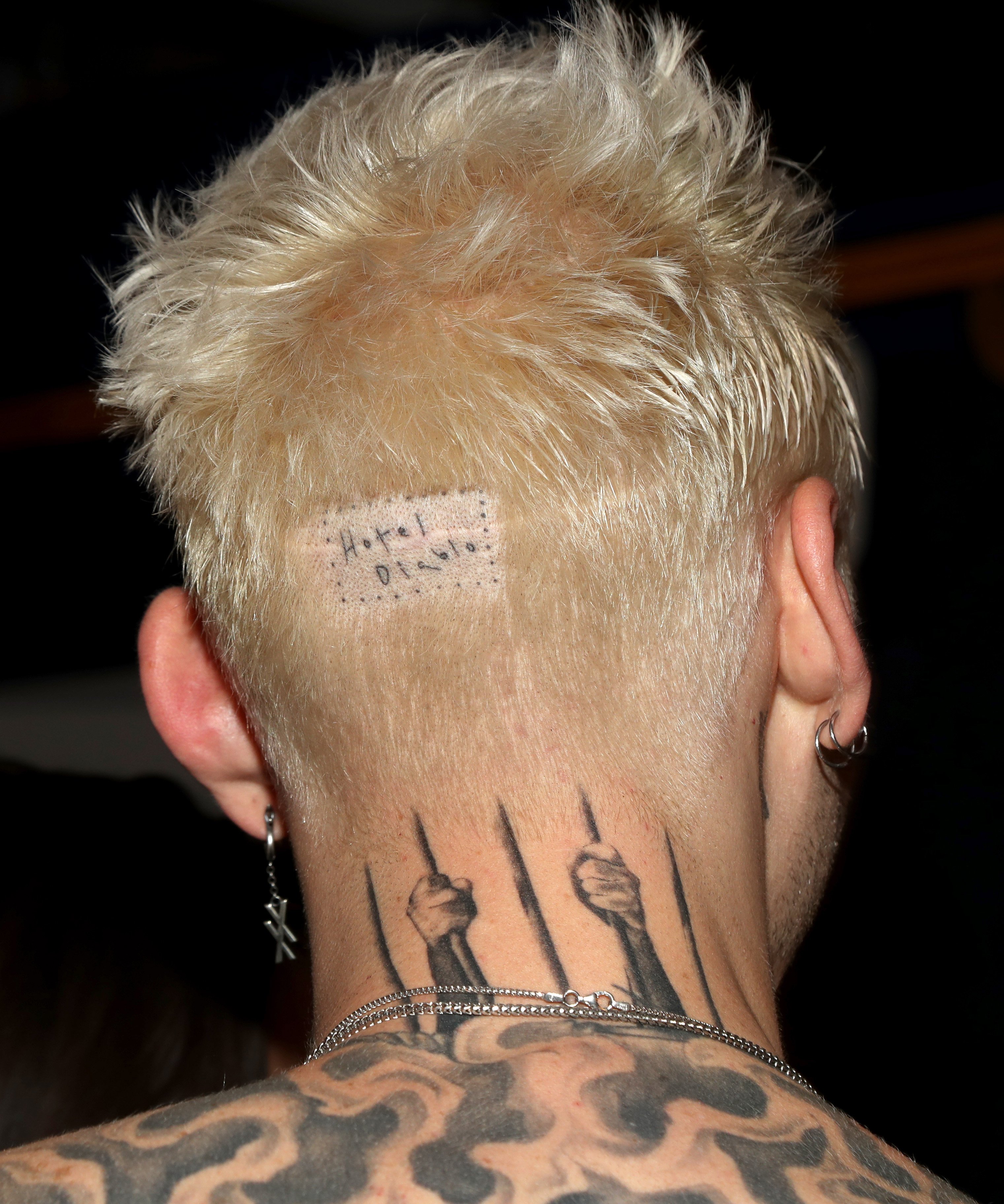  Machine Gun Kelly's tattoo detail on his head. | Source: Getty Images