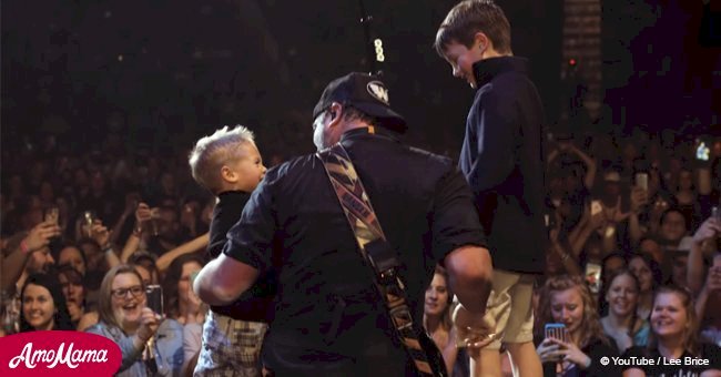 Country singer gets an amazing surprise on stage from his own boys while singing 'Boy'