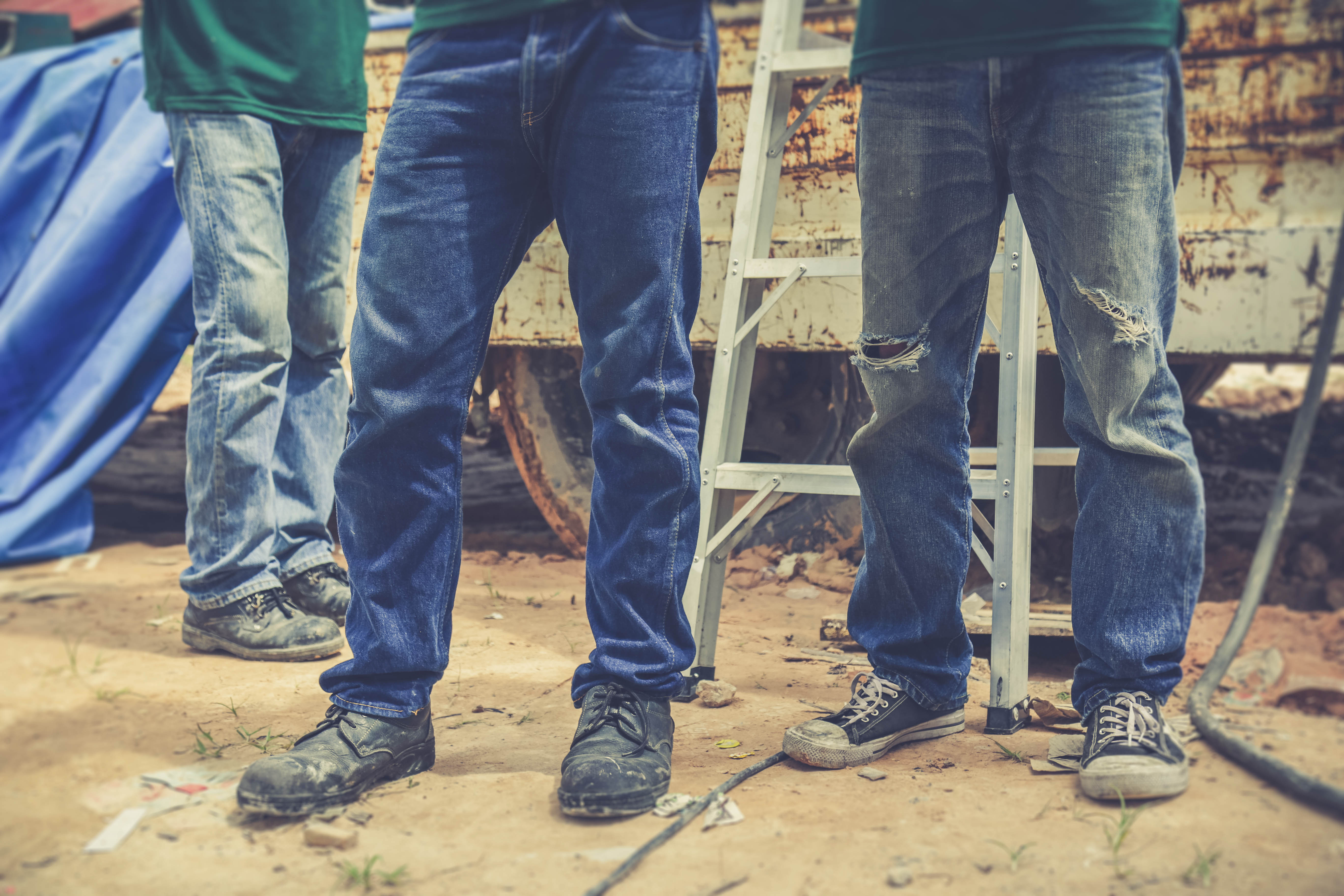 Men at work wearing denim jeans | Source: Shutterstock