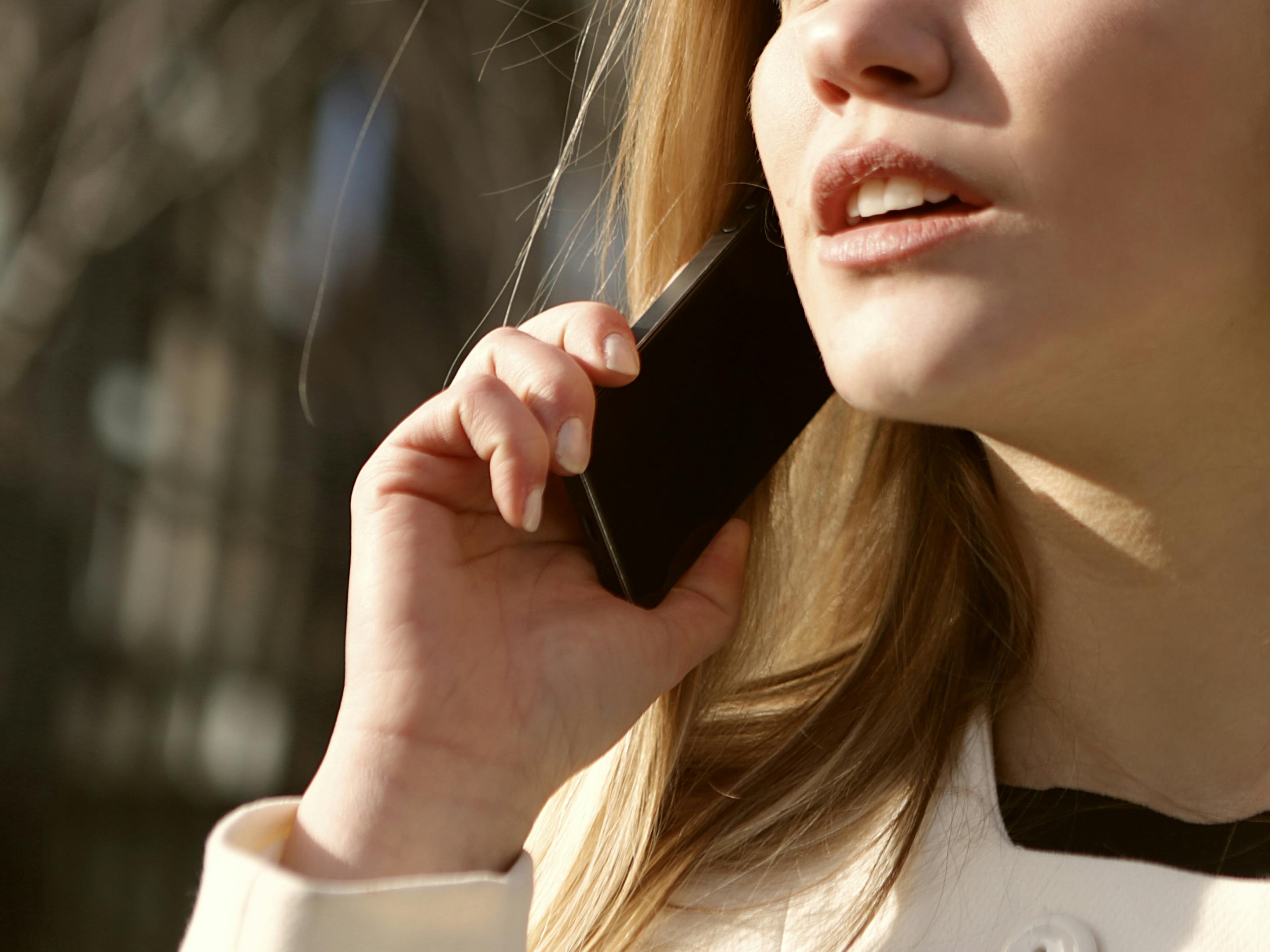 A woman on a mobile call, looking worried | Source: Pexels