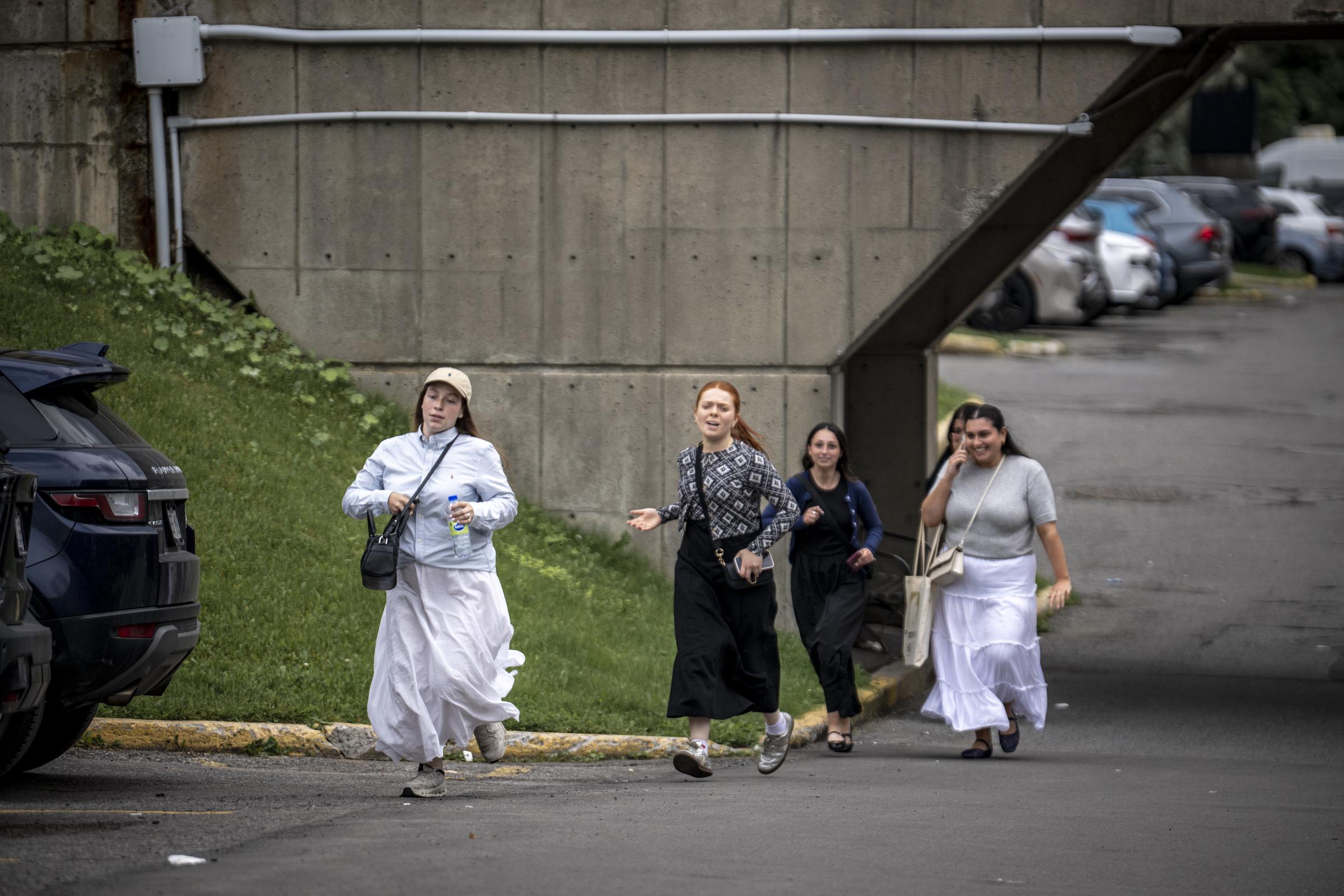 People rushed away from the area as the shooting unfolded in Côte-des-Neiges. Witnesses later described a chaotic scene as gunfire erupted and police moved quickly to secure the neighborhood. | Source: Getty Images