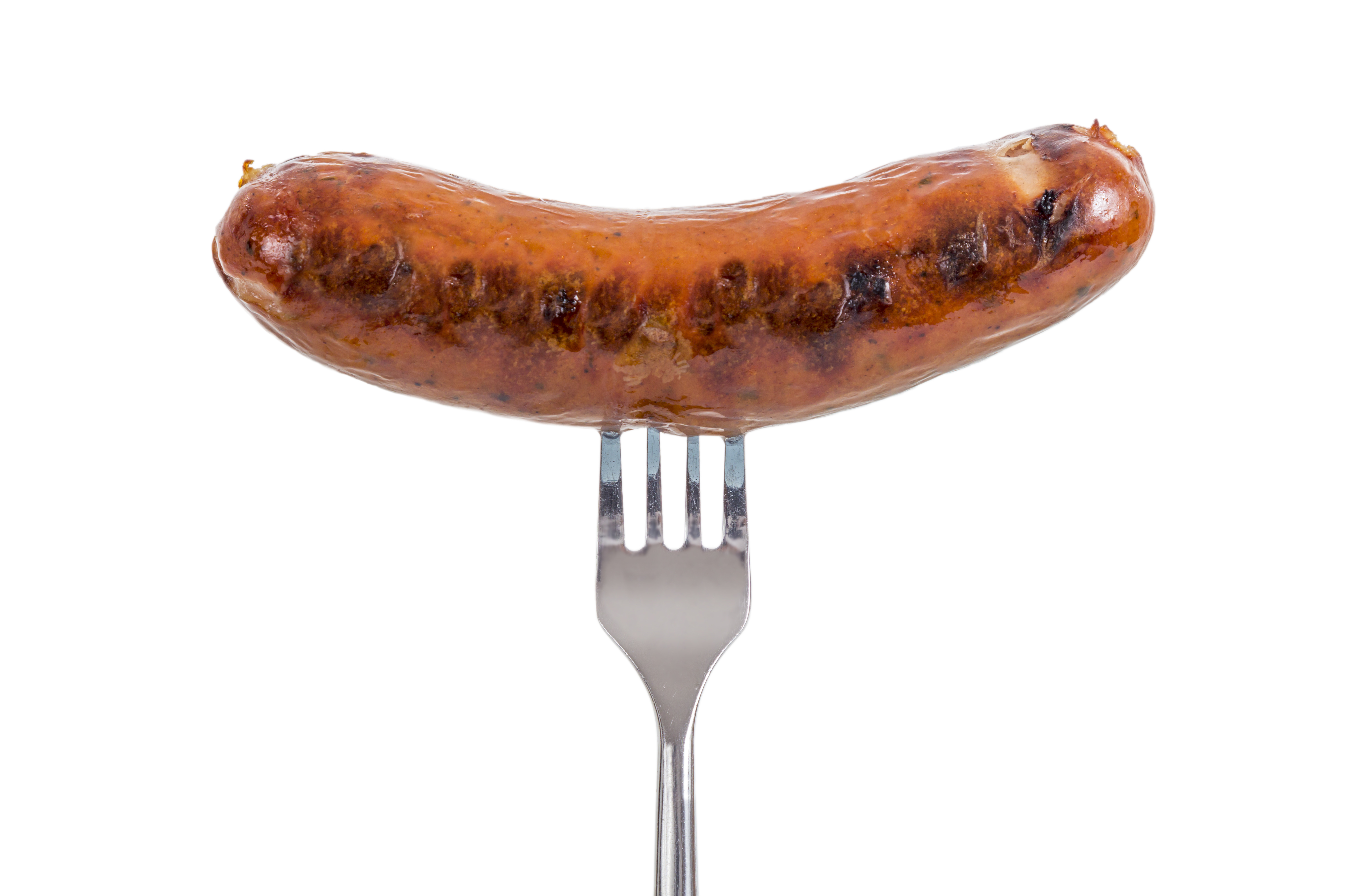 A sausage on a fork | Source: Shutterstock