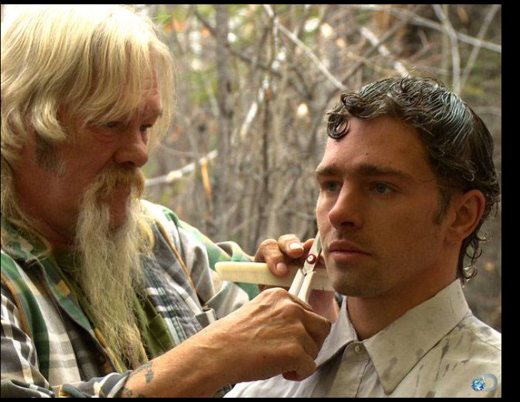 Billy Brown gives one of his sons a haircut during an episode of "Alaskan Bush People," years before his death. | Source: Facebook/Alaskan Bush People