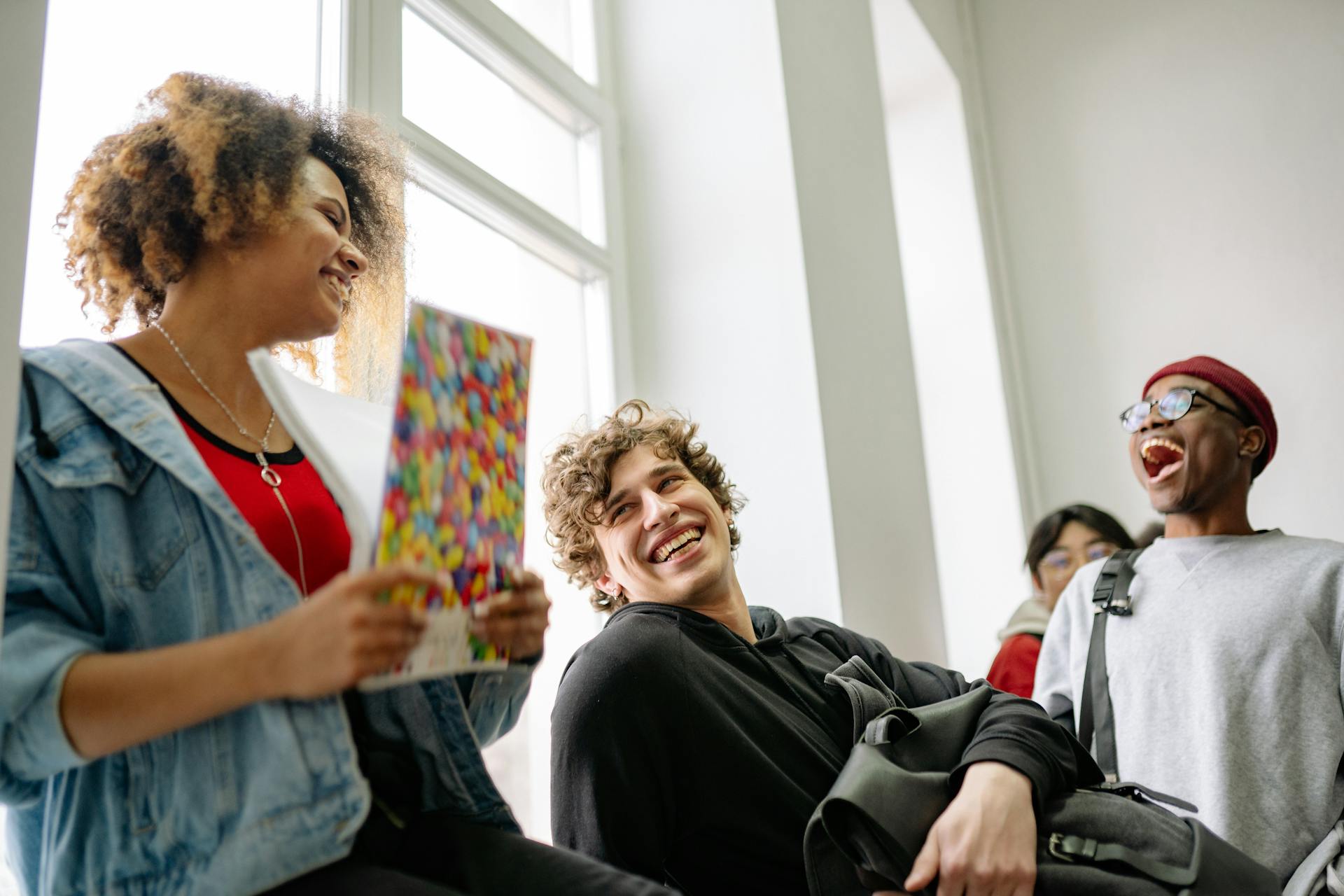 A group of young students laughing | Source: Pexels