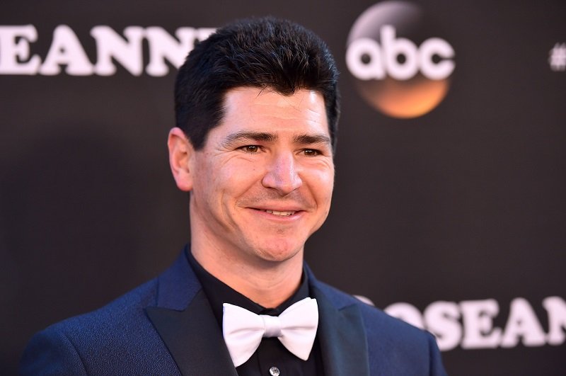 Michael Fishman attending the premiere of "Roseanne" in Burbank, California, in March 2018. | Image: Getty Images.