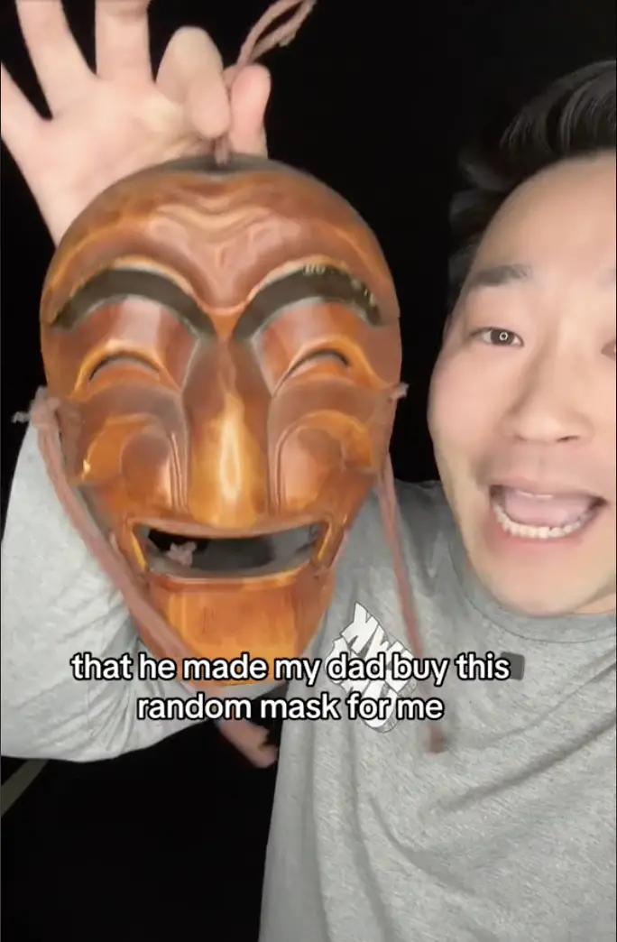 Ed Choi showing the mask he received from his long-lost father, as seen in a video dated November 10, 2023 | Source: TikTok/etchaskej