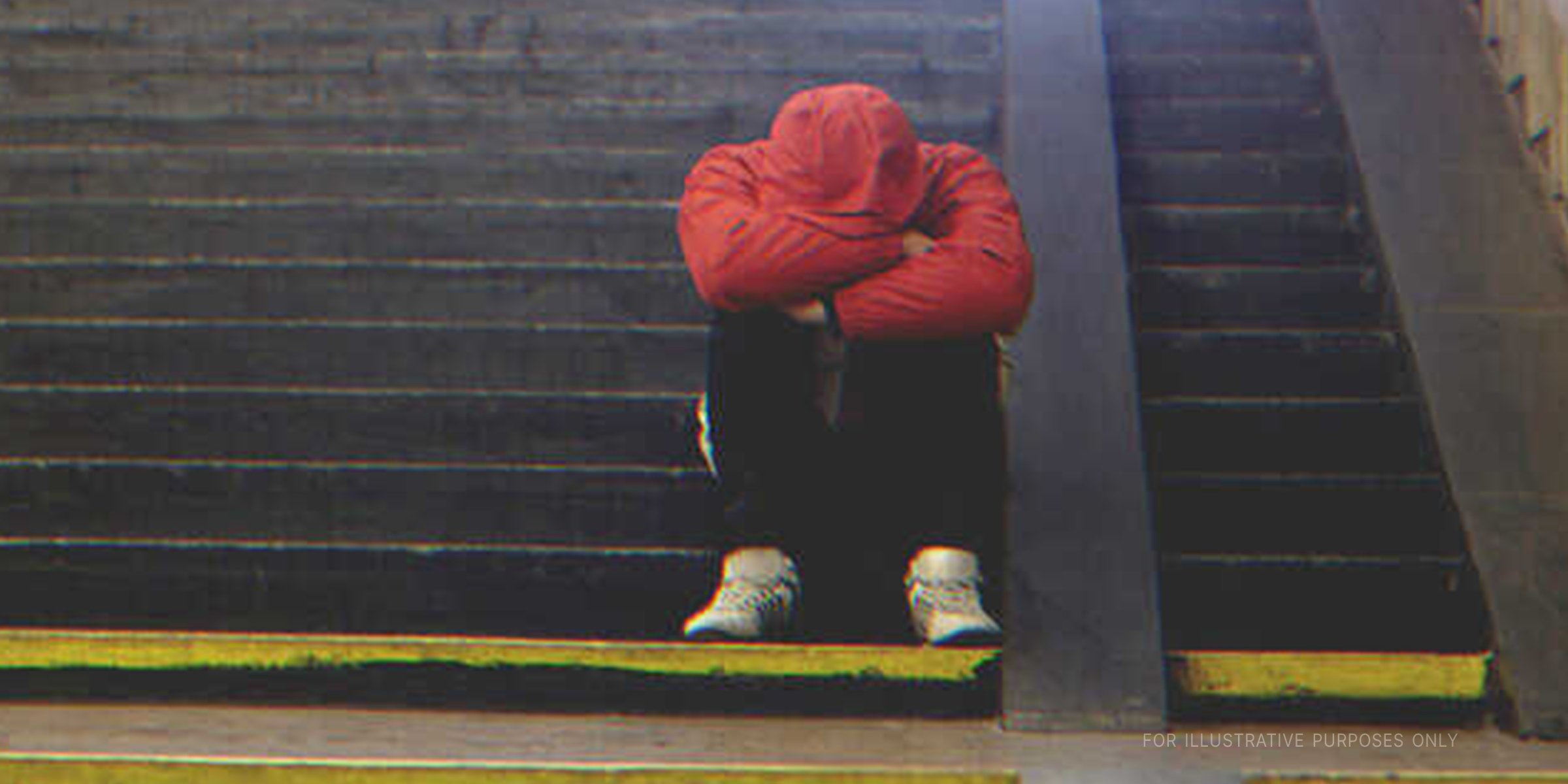 Sad Teen Sitting On Subway Stairs. | Source: Shutterstock