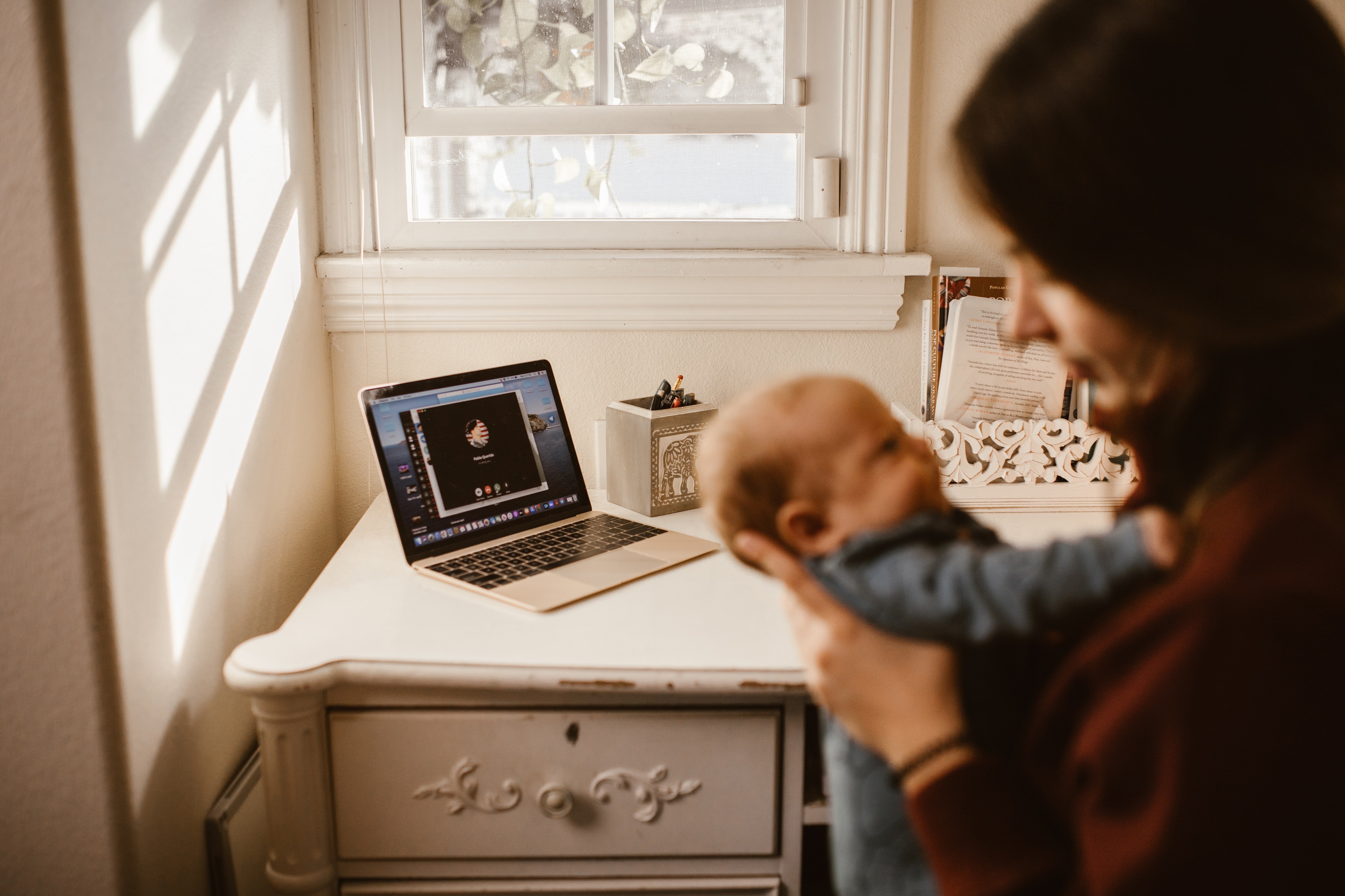 Woman stares at her baby | Photo: Pexels