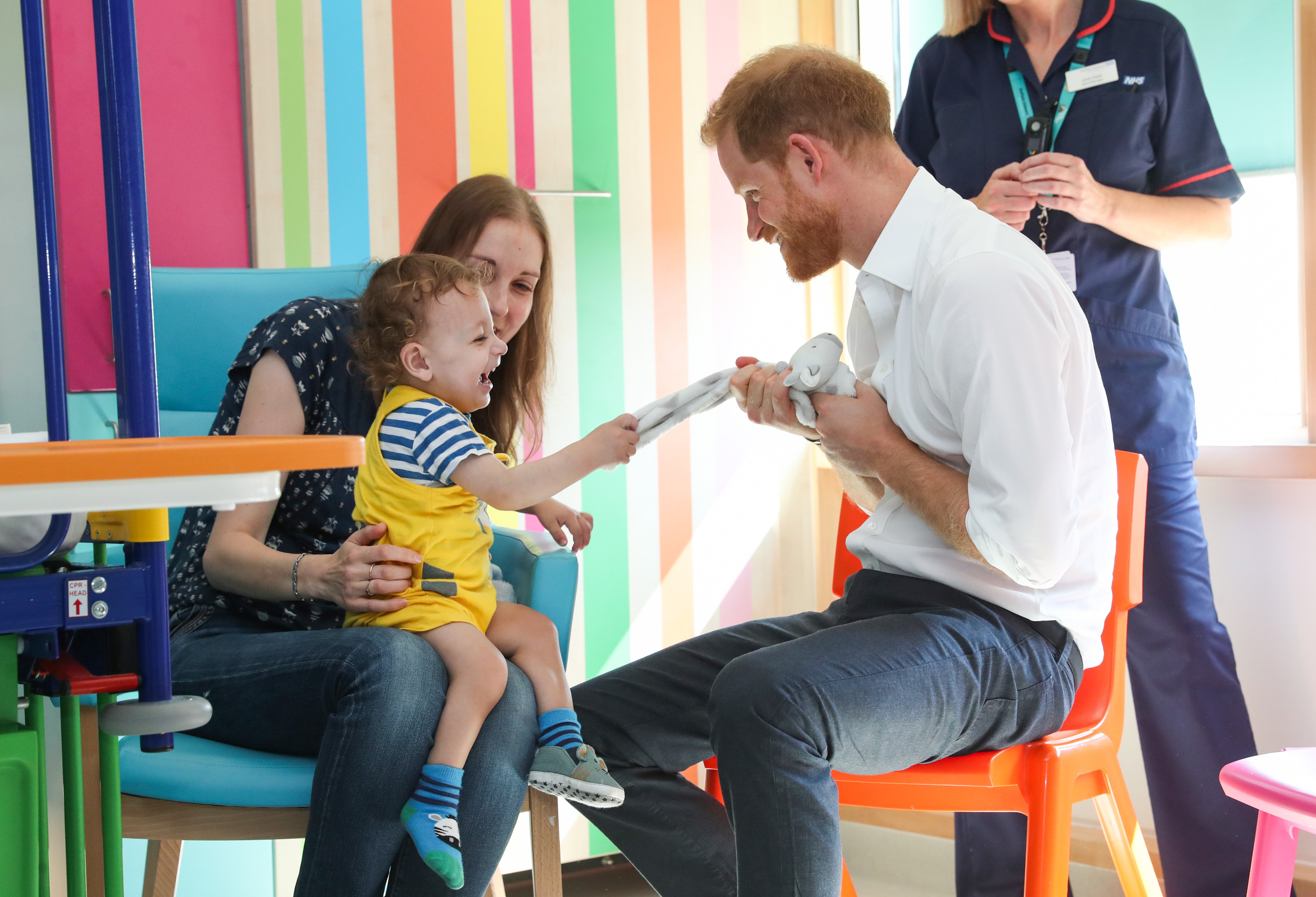 Prince Harry interacts with Noah Nicholson during a visit to Sheffield Children's Hospital on Thursday July 26, 2019 | Photo:Getty Images