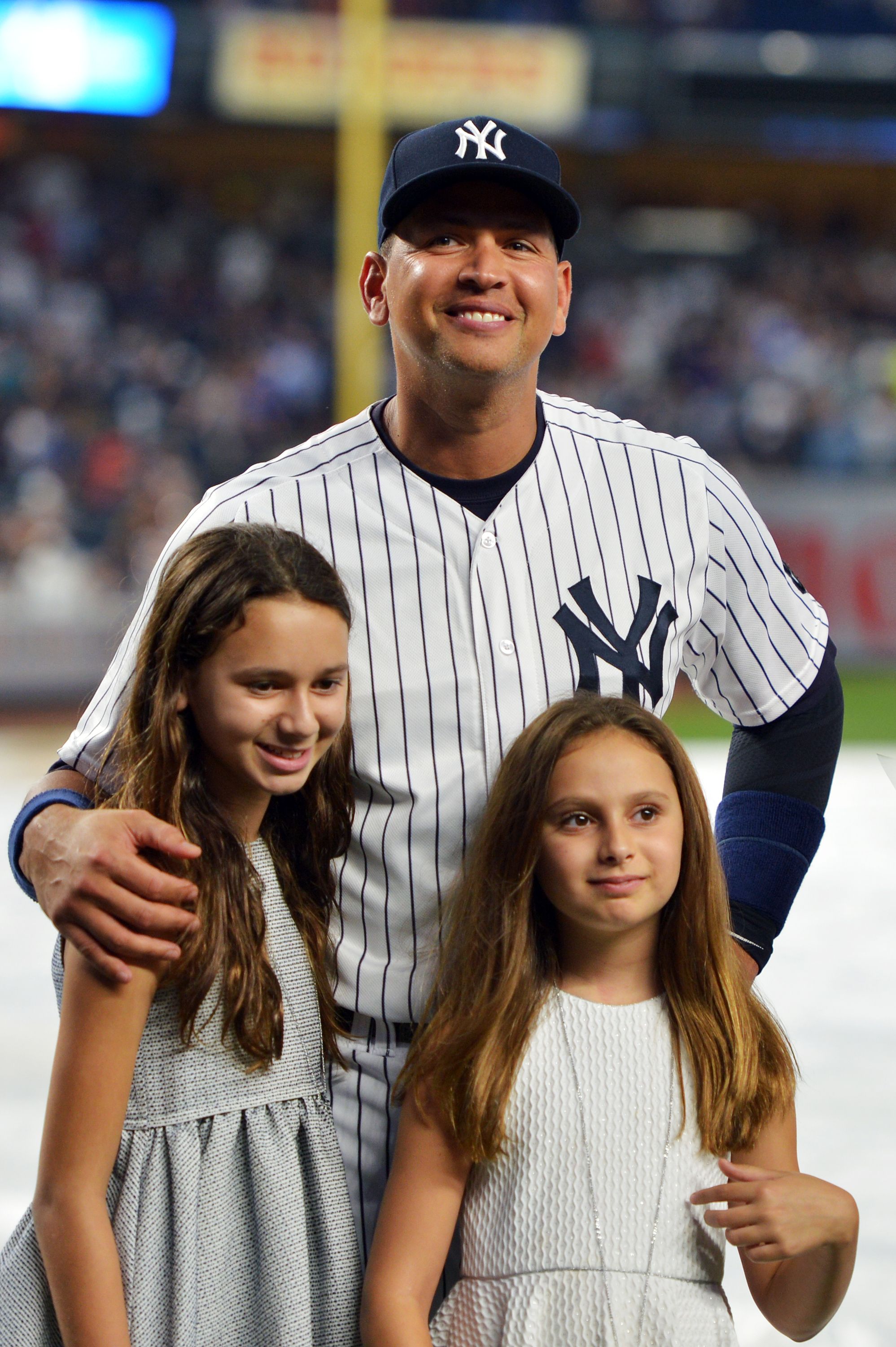  Alex Rodriguez with his daughters Natasha and Ella during a presentation in his honor before the game against the Tampa Bay Rays at Yankee Stadium on August 12, 2016 in New York City. | Source: Getty Images
