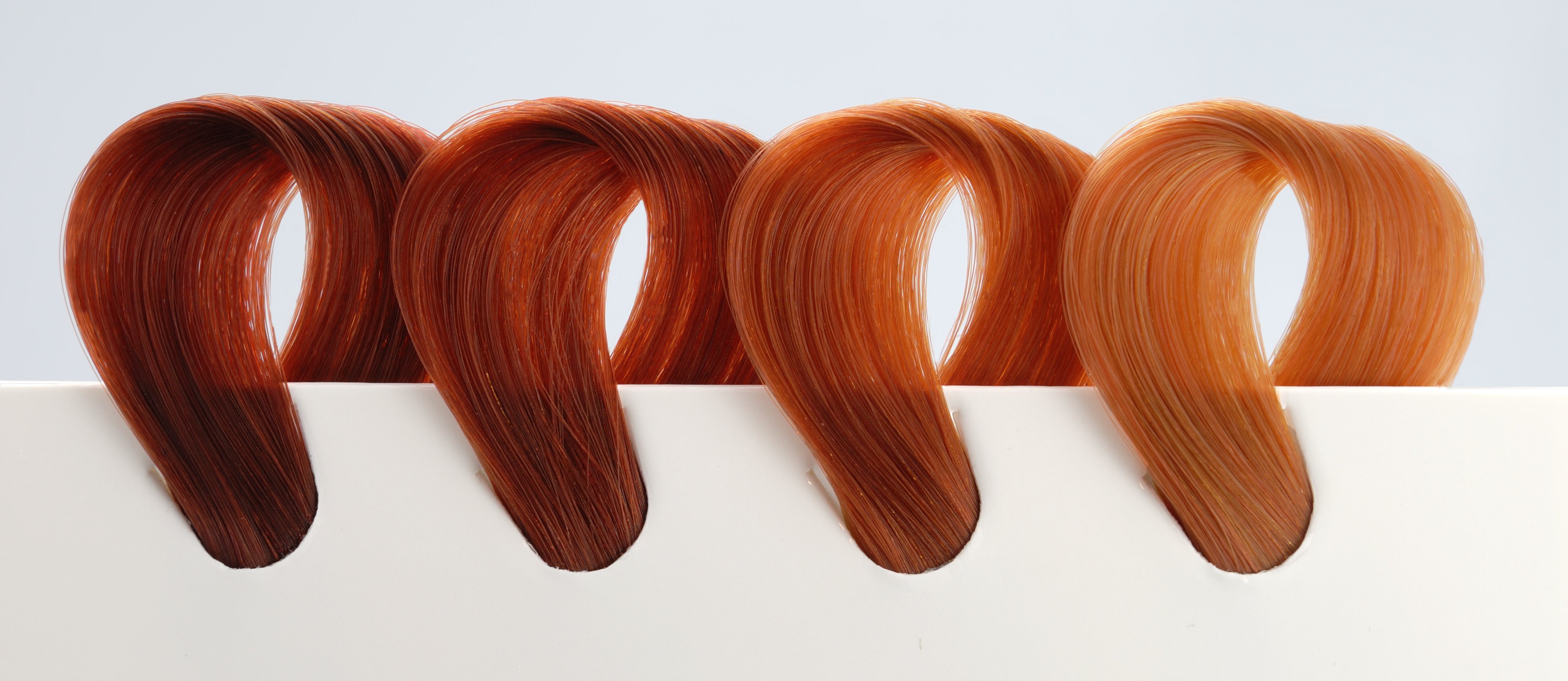 A picture of locks of hair colored in different shades of copper | Source: Getty Images