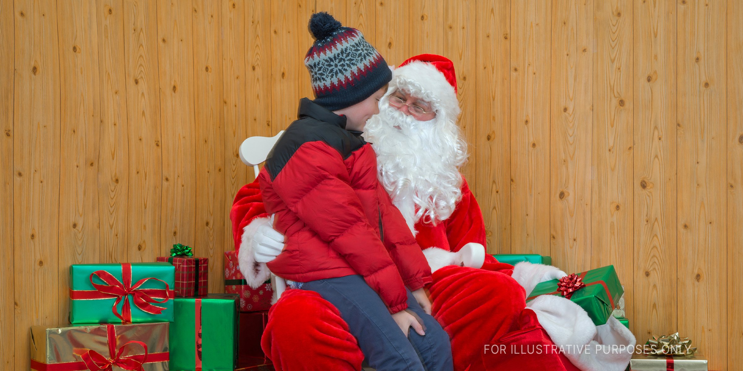 Santa sitting with boy | Source: Getty Images