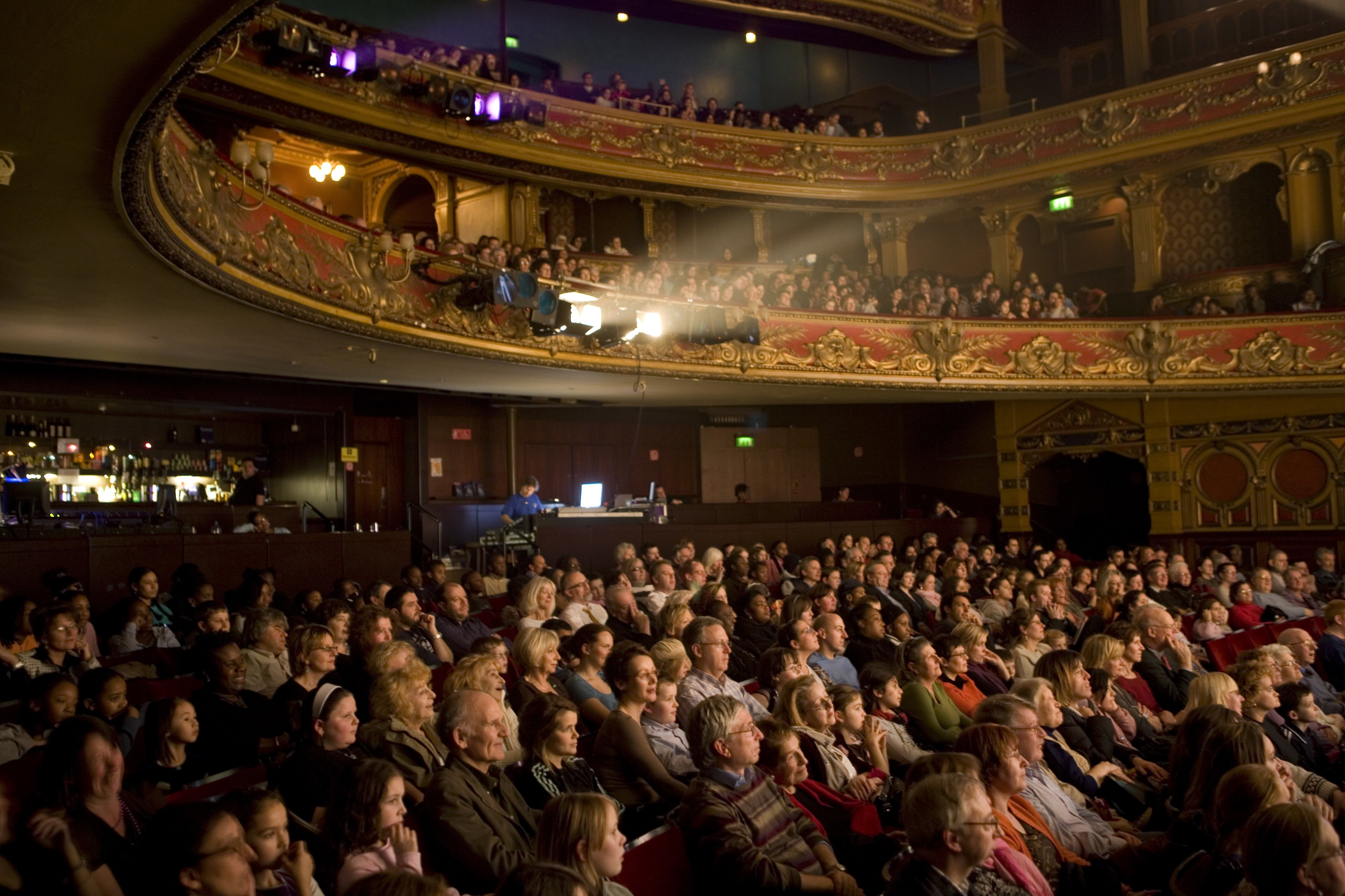 A captivated audience watches a performance at the Hackney Empire Theatre| Photo: Getty Images