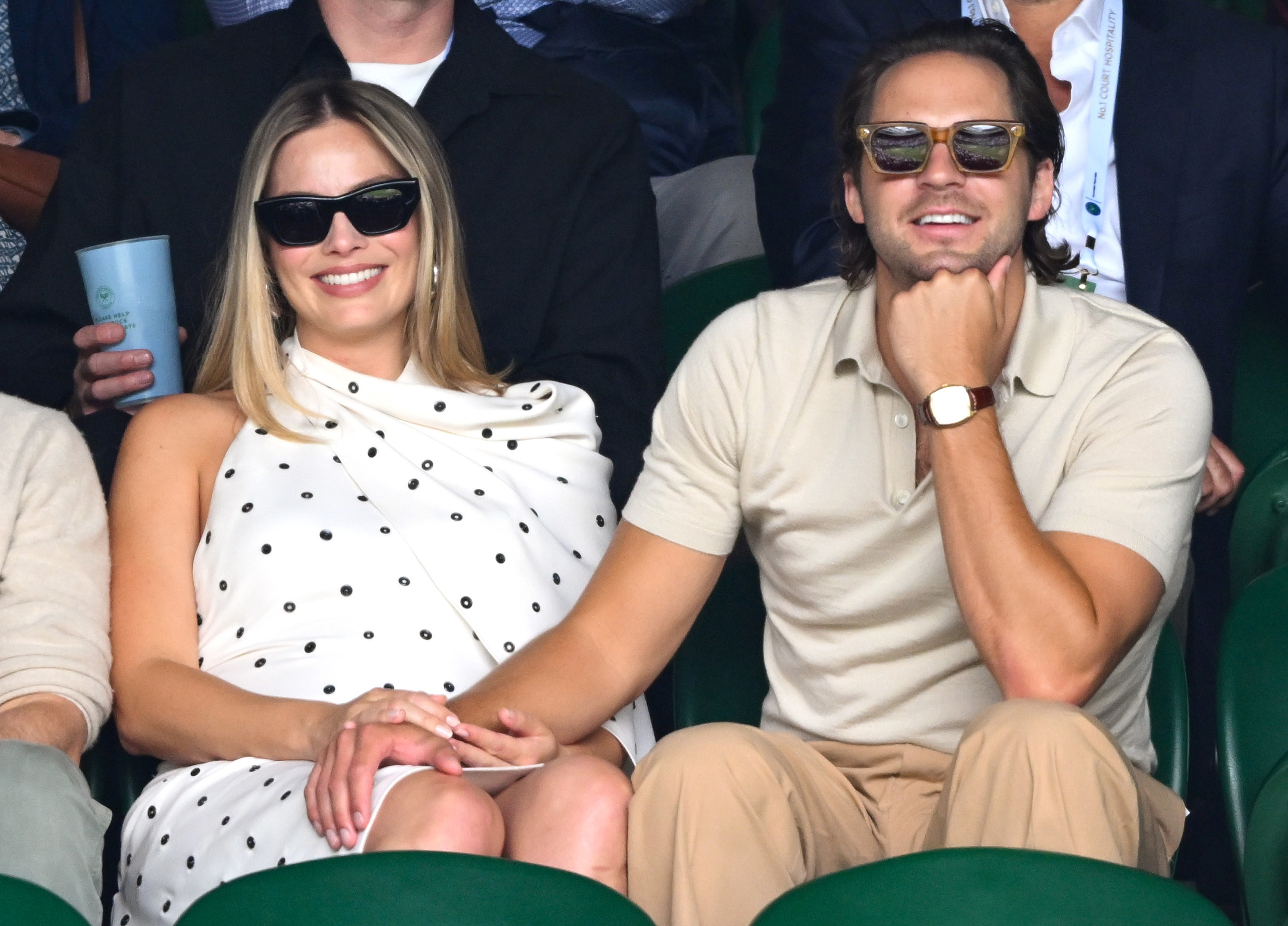 Margot Robbie and Tom Ackerley holding hands at day 12 of the Wimbledon Tennis Championships at the All England Lawn Tennis and Croquet Club on July 12, 2024 in London, England | Source: Getty Images