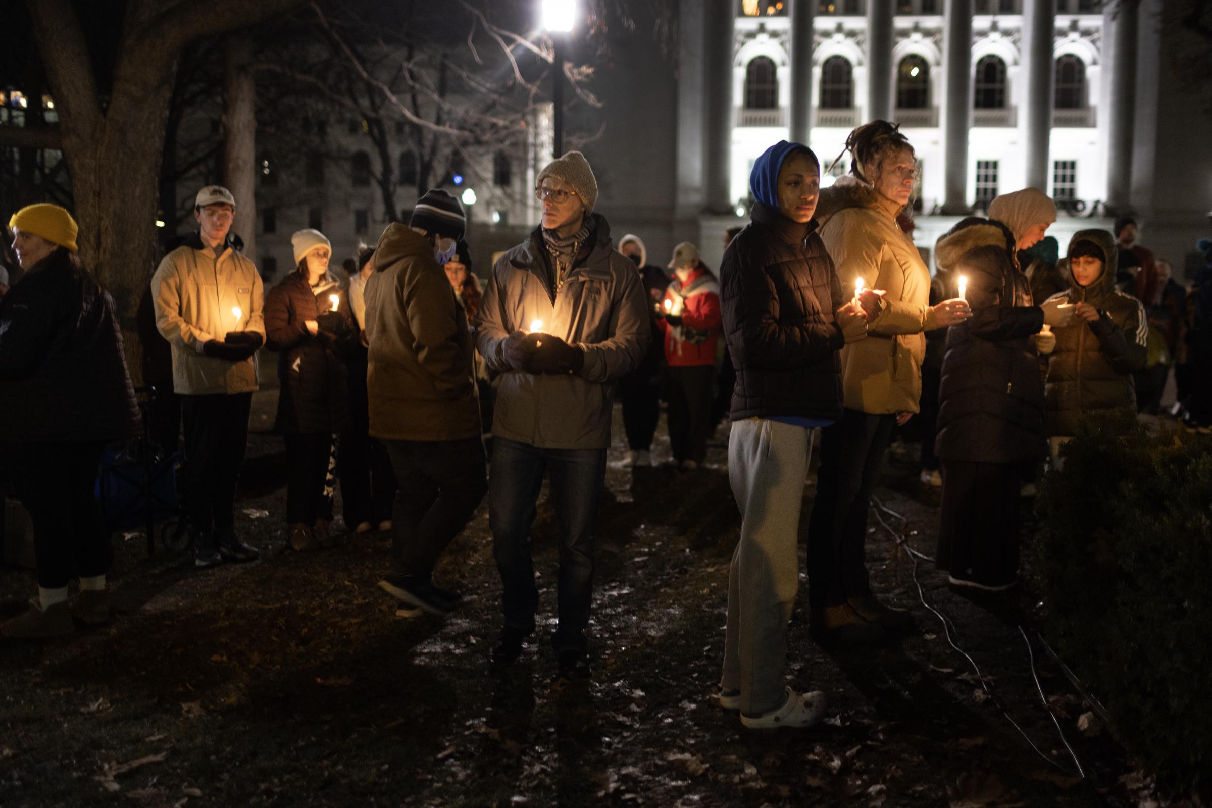 People at a vigil at the state Capitol building to mourn the victims of the shooting at Abundant Life Christian School in Madison, Wisconsin, on December 17, 2024. | Source: Getty Images