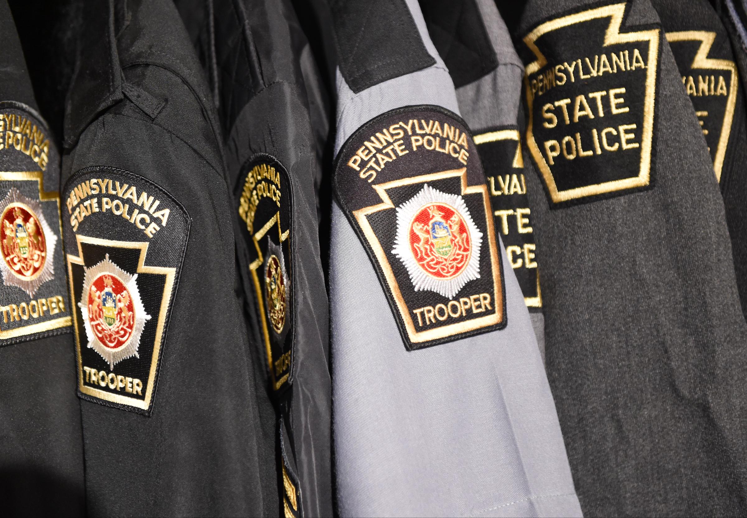 Pennsylvania State Police uniforms display official trooper patches in a close-up view. | Source: Getty Images