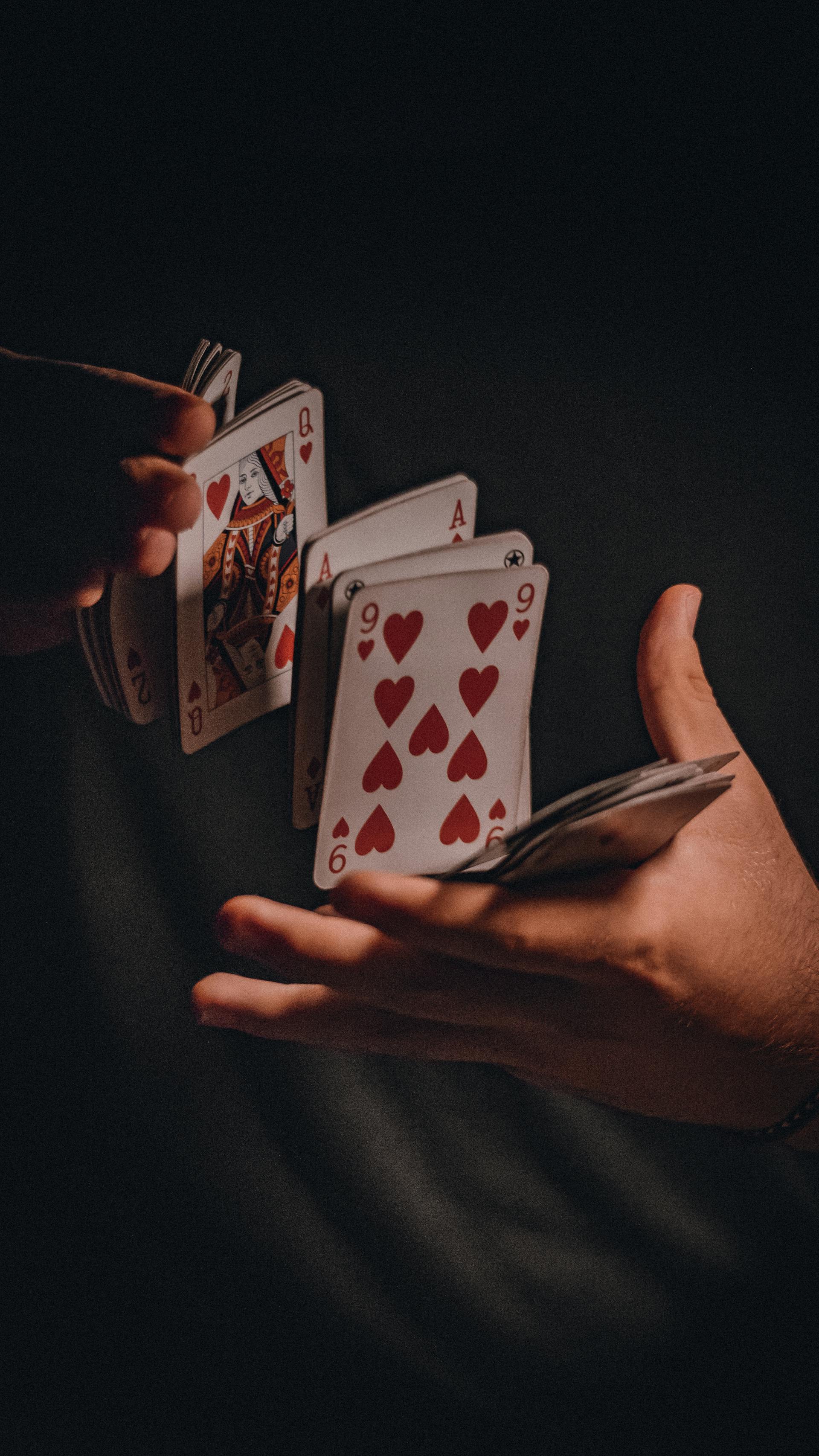 A person shuffling cards | Source: Pexels