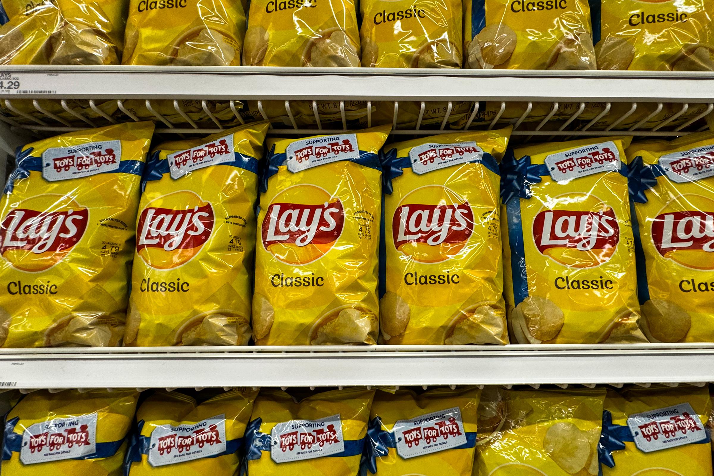 Bags of Lay's Classic chips in a grocery store in Las Vegas, Nevada on November 17, 2023 | Source: Getty Images