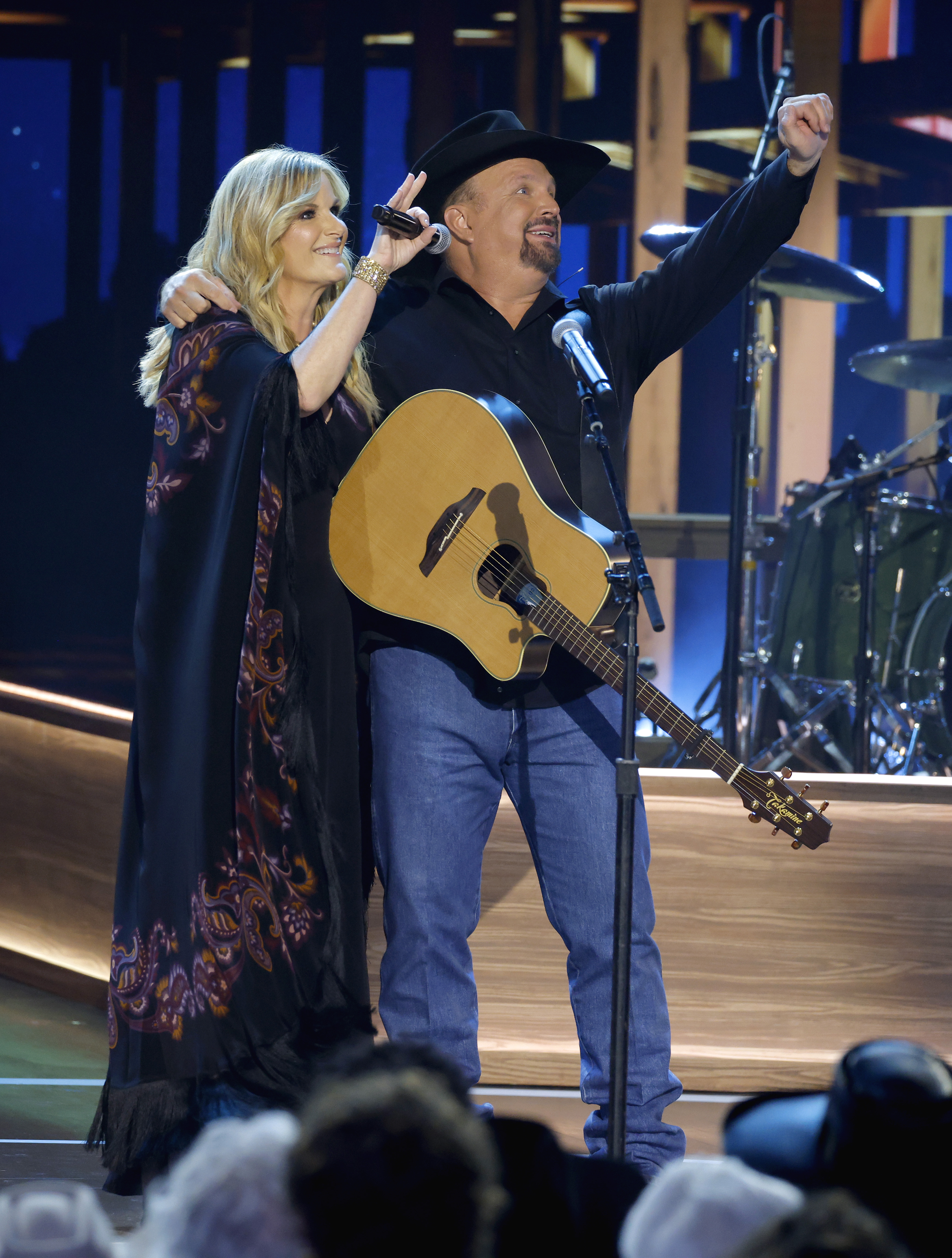 Trisha Yearwood and Garth Brooks after they were done performing. | Source: Getty Images