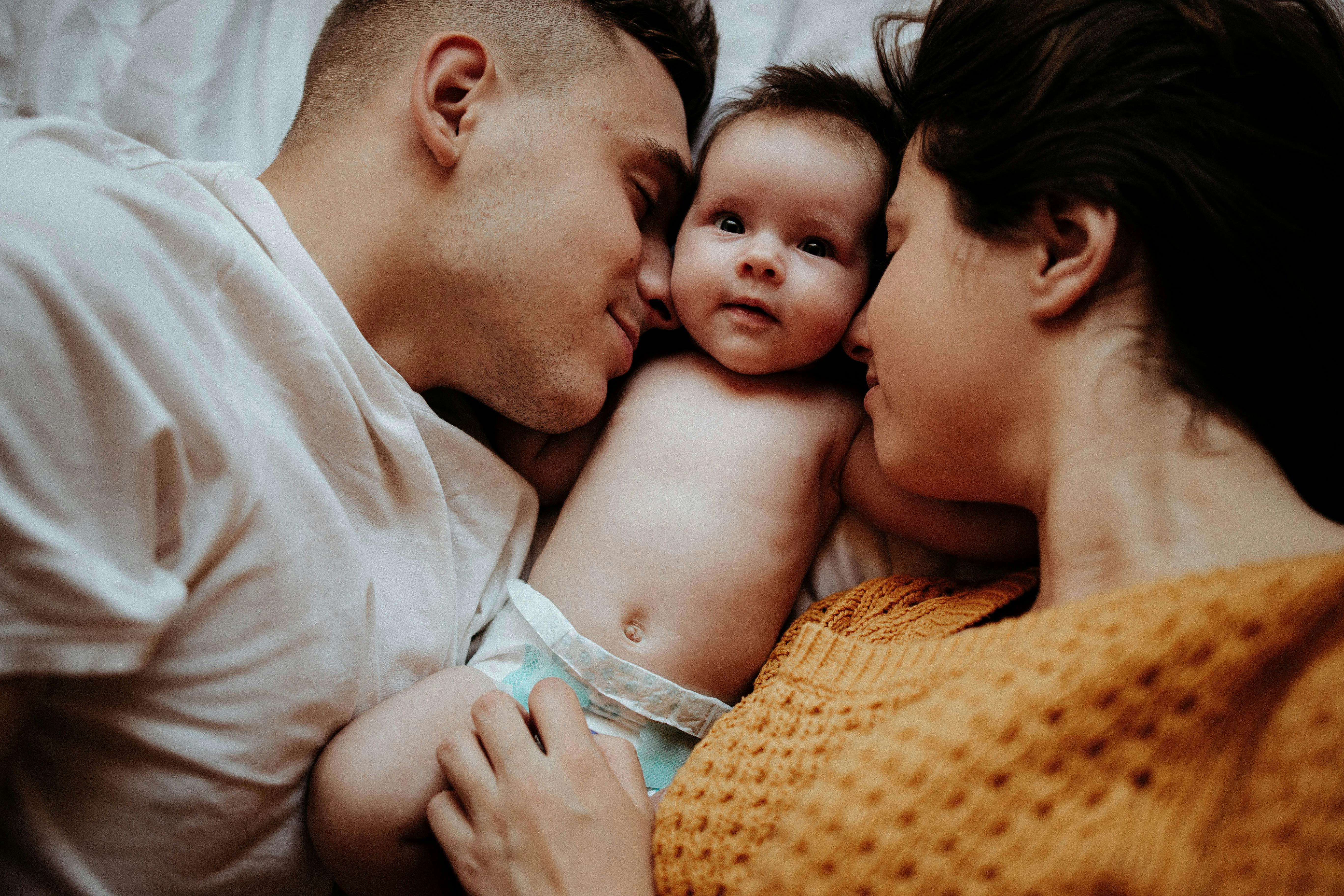 New parents doting on their baby | Source: Pexels