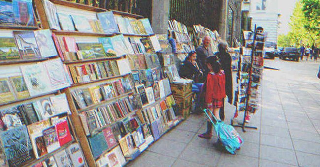 Lacy stopped to look at some books a woman was selling on the street | Source: Shutterstock.com