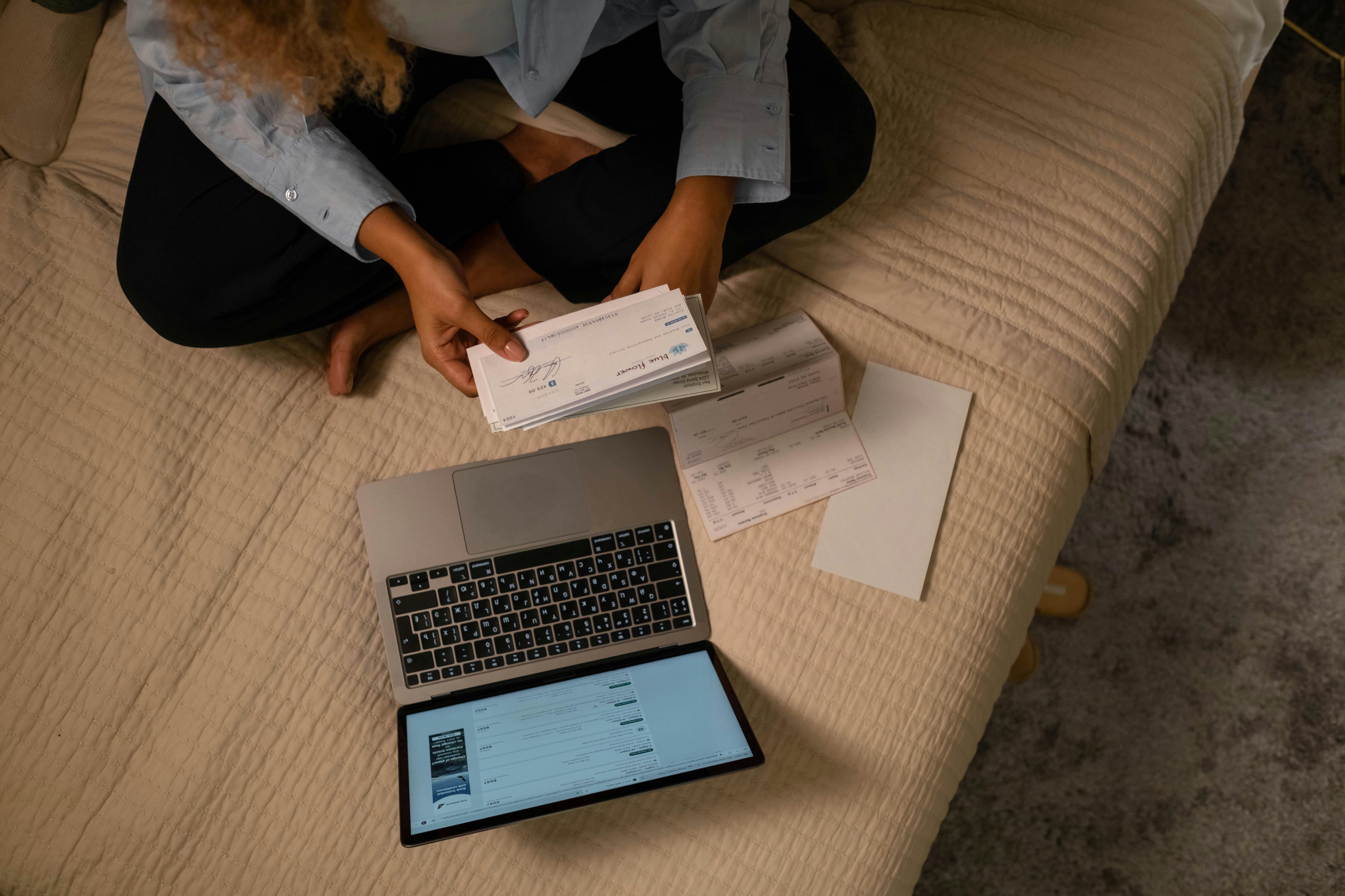 A woman looking at a cheque | Source: Pexels