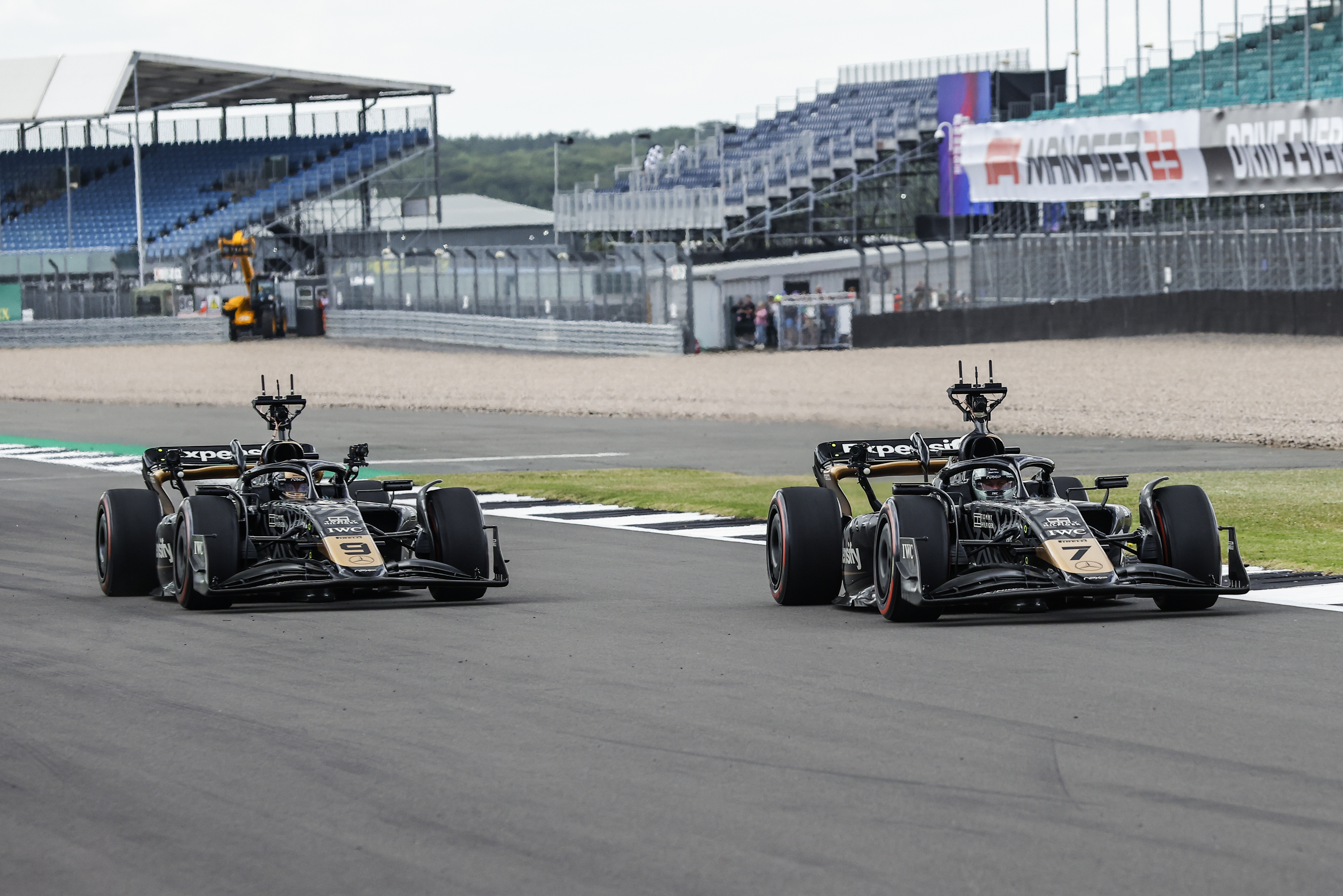 Brad Pitt and Damson Idris at the Apex APXGP, action during the Formula 1 Aramco British Grand Prix in July 2023 | Source: Getty Images