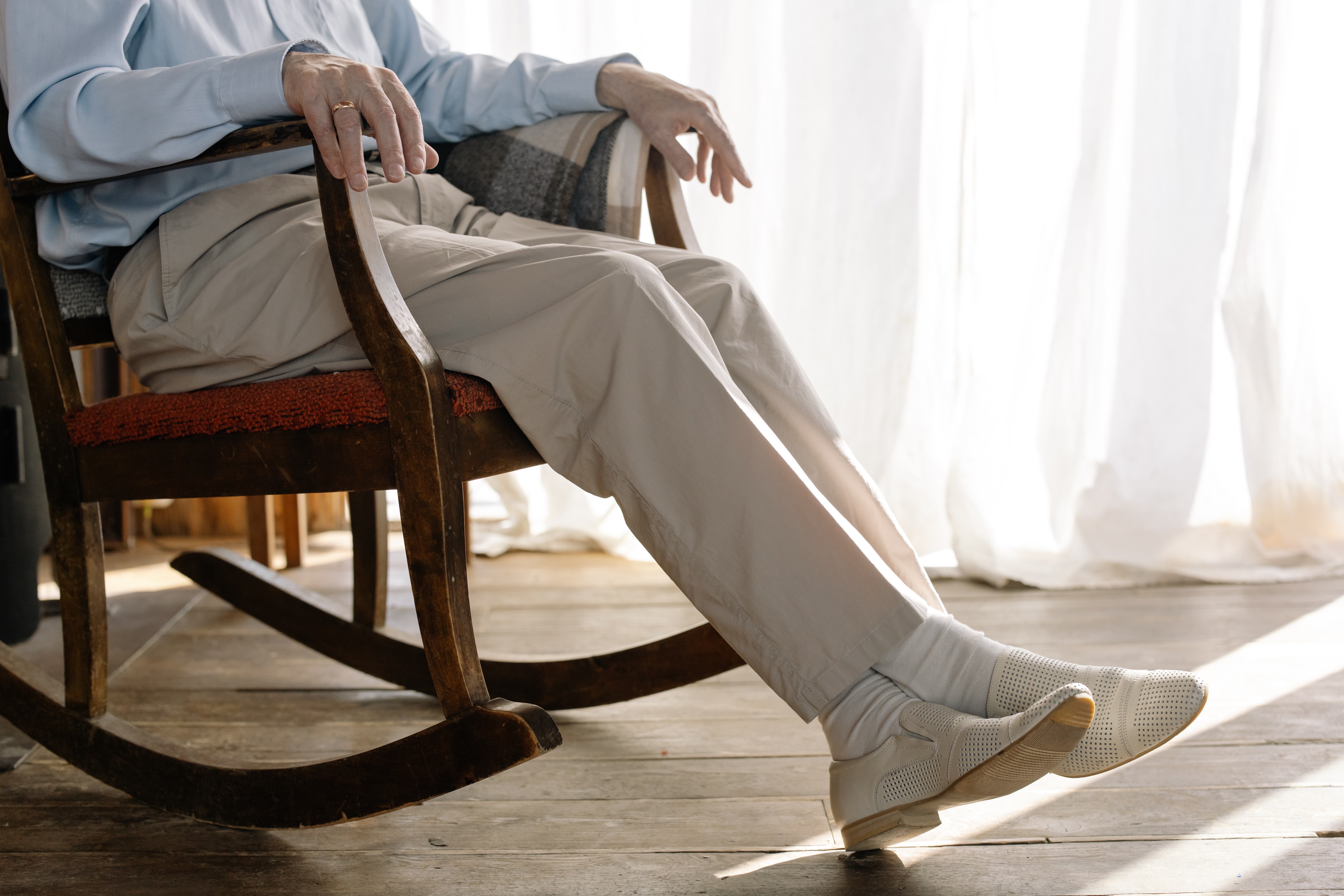 Pictured - A male individual on a rocking chair | Source: Pexels 
