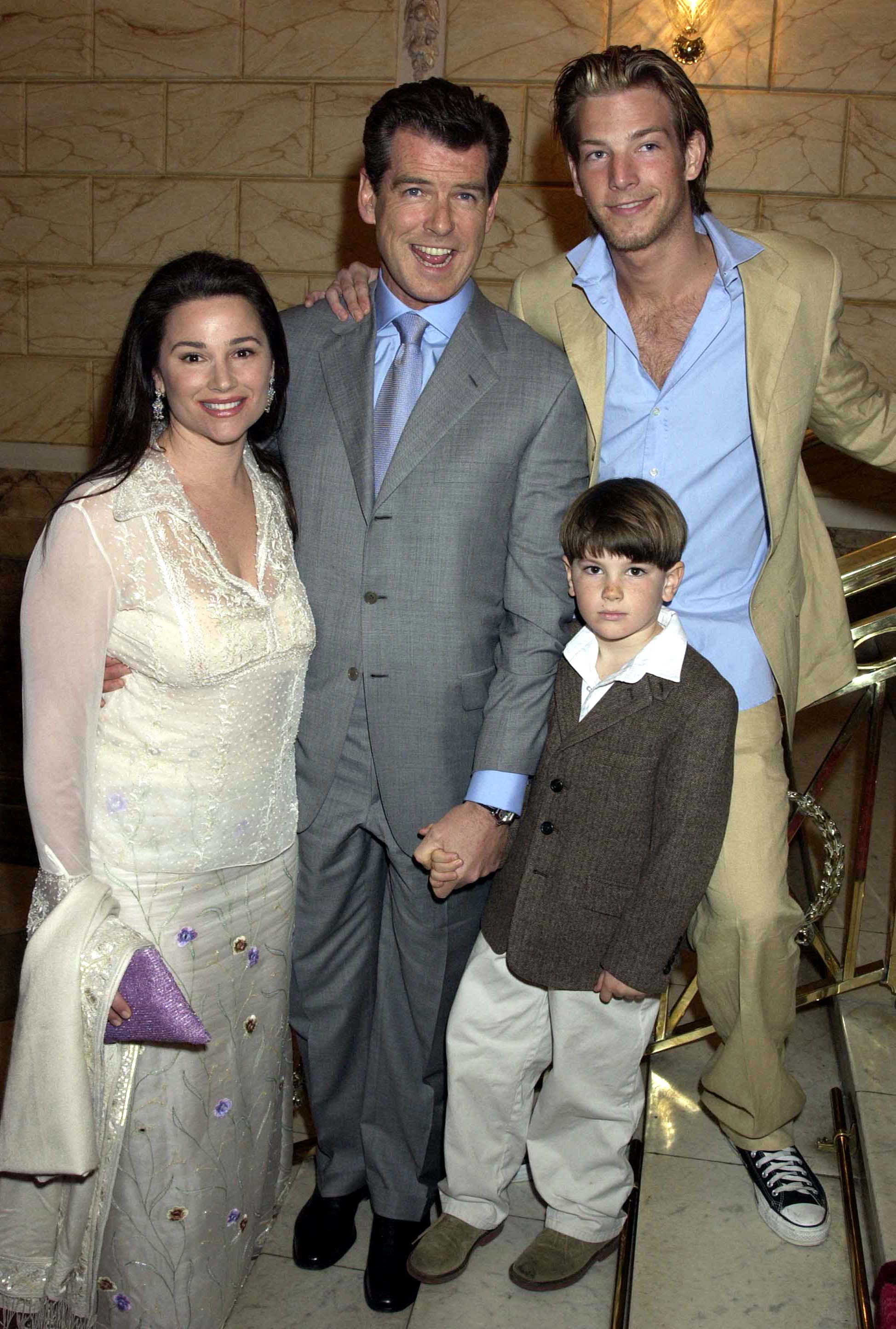Keely Shaye Smith, Pierce Brosnan, Dylan Brosnan, and Sean Brosnan at the "Chitty Chitty Bang Bang" opening night at The London Palladium Theatre on April 16, 2002 | Source: Getty Images