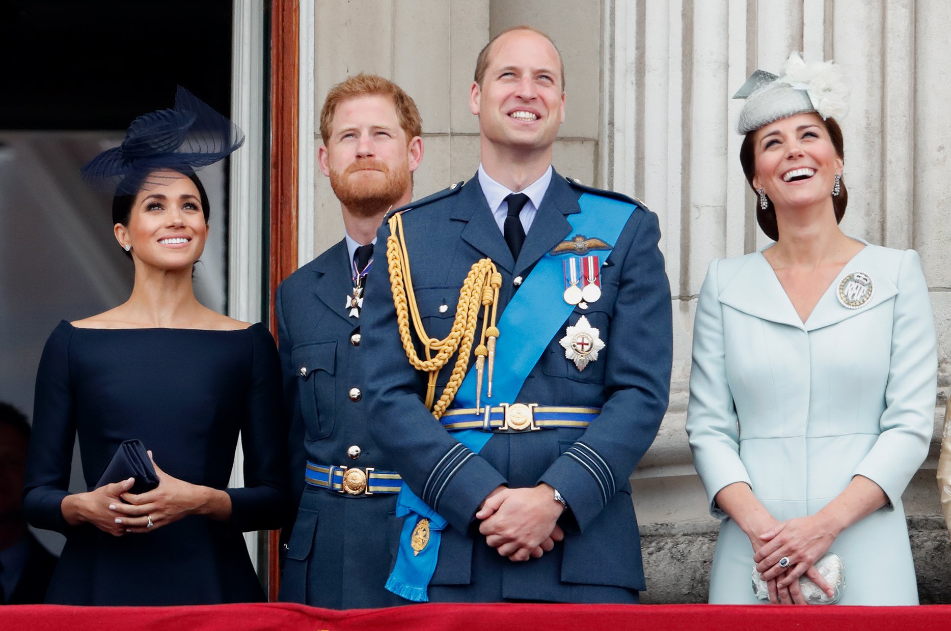 Duchess Meghan, Prince Harry, Prince William, and Duchess Kate marking the centenary of the Royal Air Force from the balcony of Buckingham Palace on July 10, 2018, in London, England. | Source: Max Mumby/Indigo/Getty Images