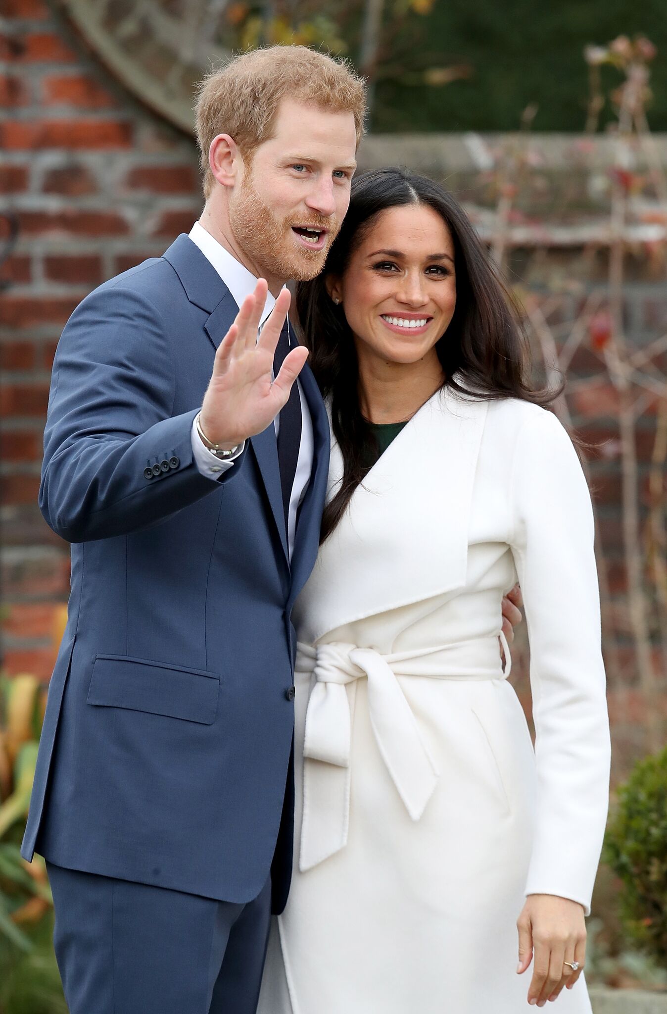 Prince Harry and actress Meghan Markle during an official photocall to announce their engagement at The Sunken Gardens at Kensington Palace | Getty Images