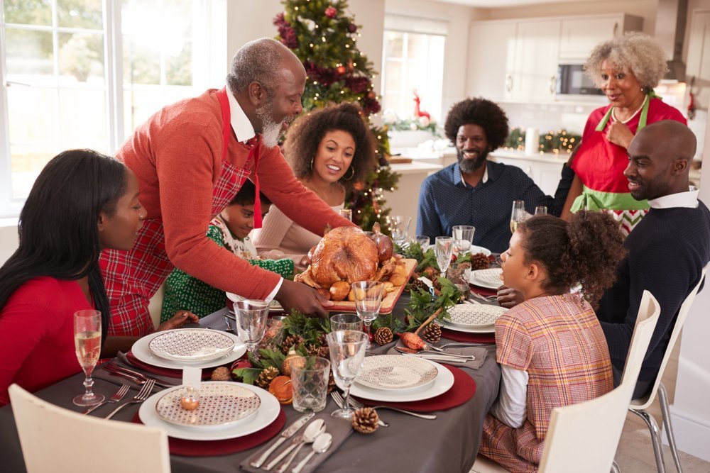 A family having a good time during Christmas. | Photo: Shutterstock