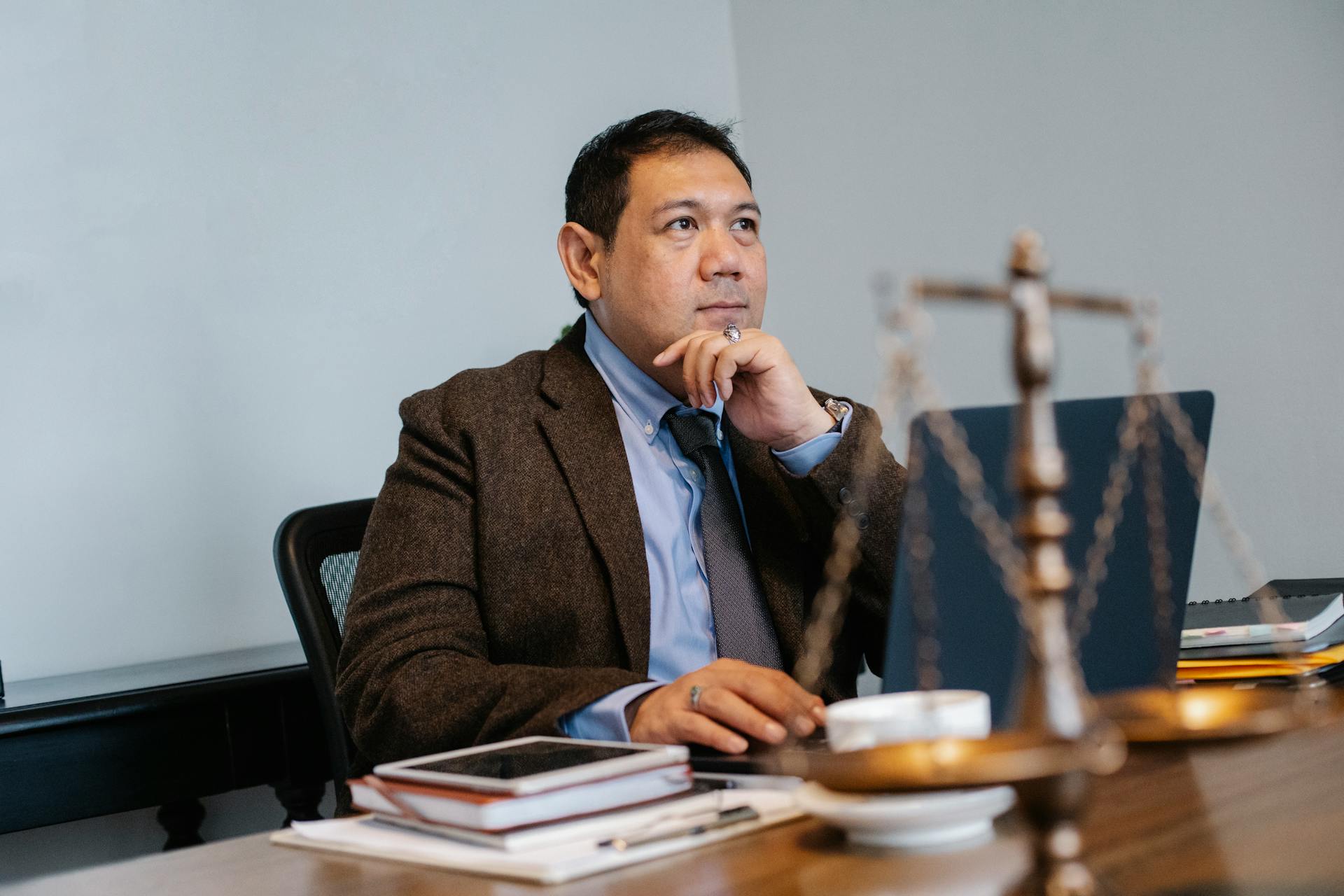 A lawyer sitting at his desk | Source: Pexels