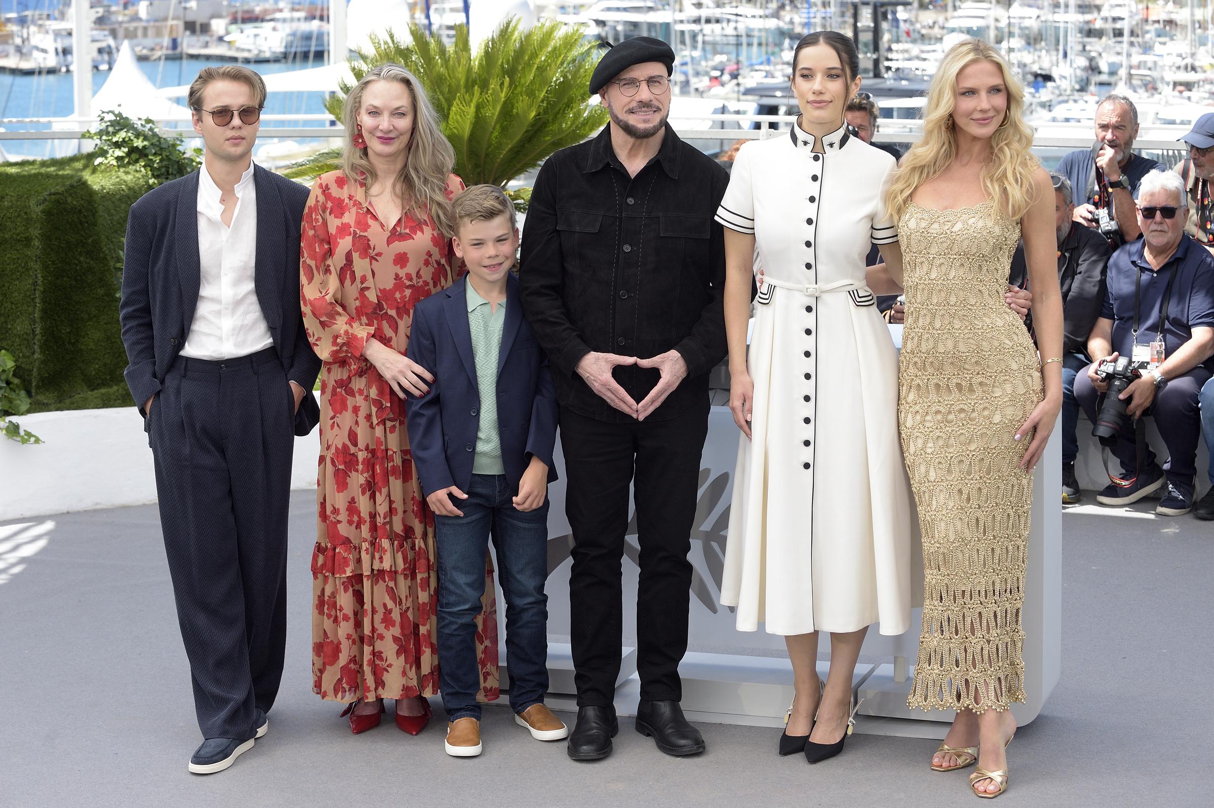 Edouard Philipponnat, Kelly B. Eviston, Clark Shotwell, John Travolta, Ella Bleu Travolta, and Olga Hoffmann during the "Propeller One-Way Night Coach" photocall at the Cannes Film Festival on May 16, 2026, in Cannes, France | Source: Getty Images