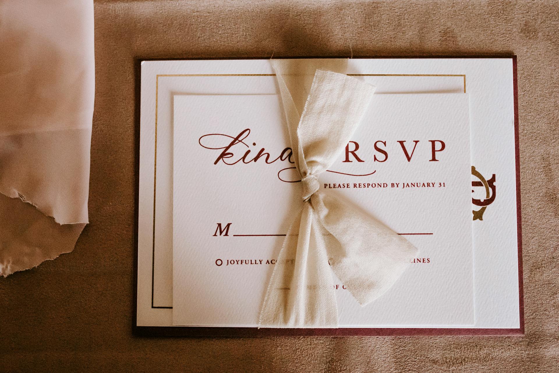 An invitation card with the inscription tied with ribbon | Source: Pexels