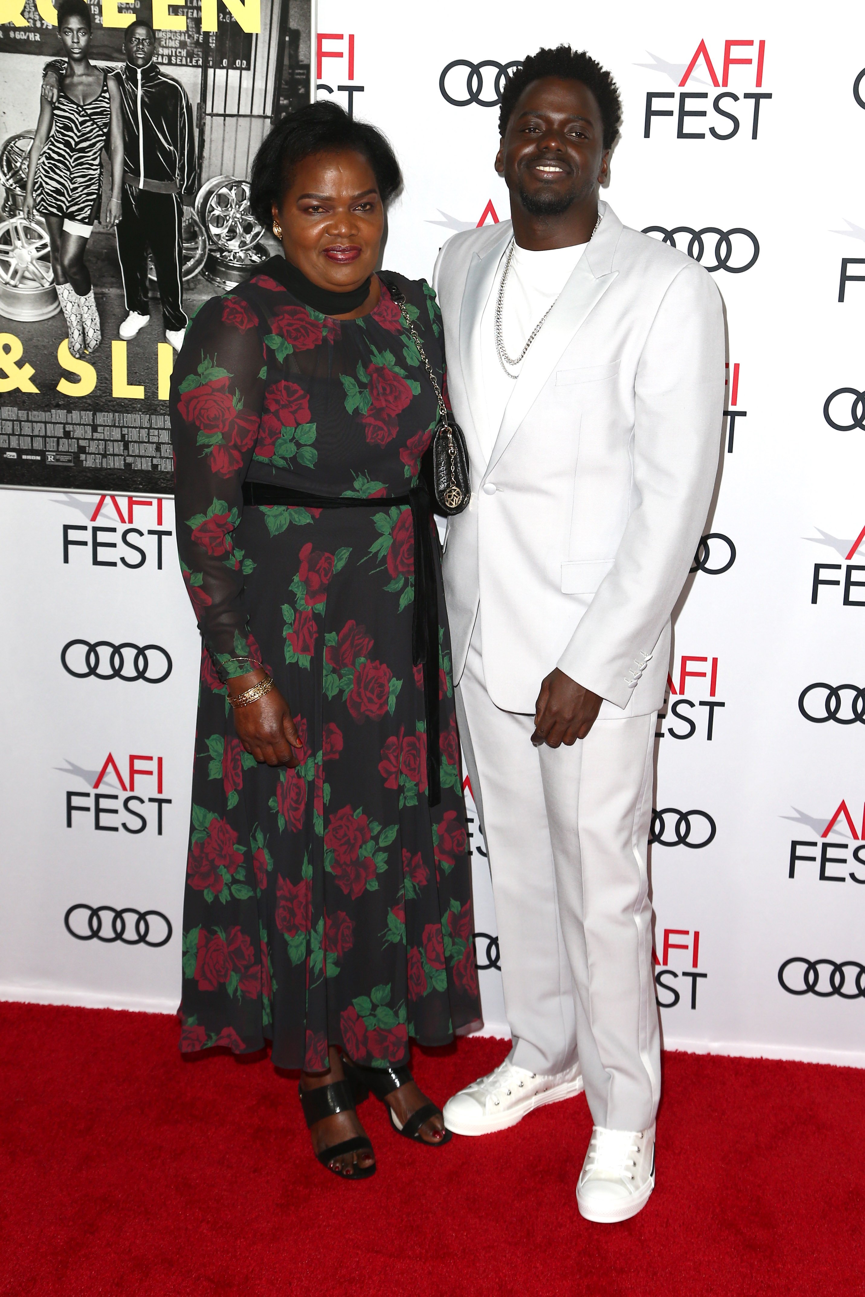 Daniel Kayuula and his mother, Damalie Namusoke, pictured at  AFI FEST 2019 Presented By Audi premiere of "Queen & Slim," 2019. | Photo: Getty Images