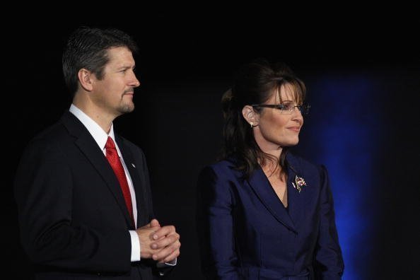 Sarah Palin and husband Todd Palin stand on stage during the election night rally at the Arizona Biltmore Resort & Spa on November 4, 2008 in Phoenix, Arizona | Photo: Getty Images