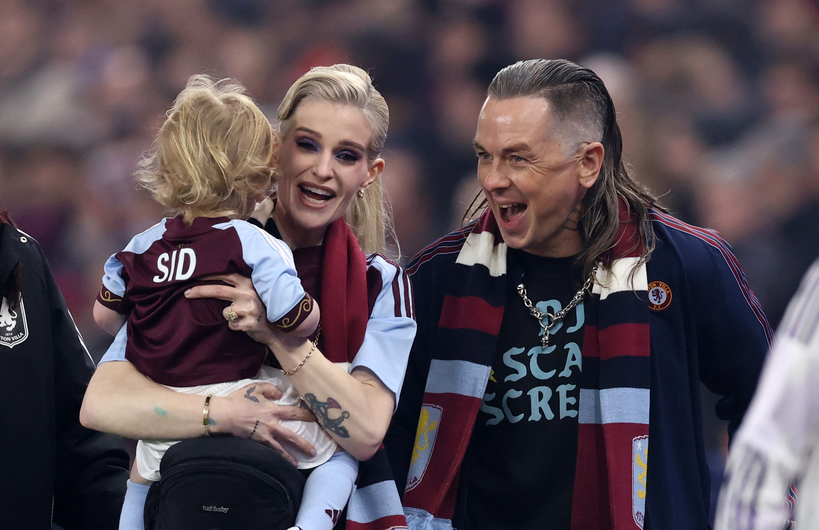Kelly Osbourne is pictured with son Sidney and partner Sid Wilson ahead of the Premier League match between Aston Villa and Manchester United at Villa Park on 21 December 2025 in Birmingham, England. | Source: Getty Images