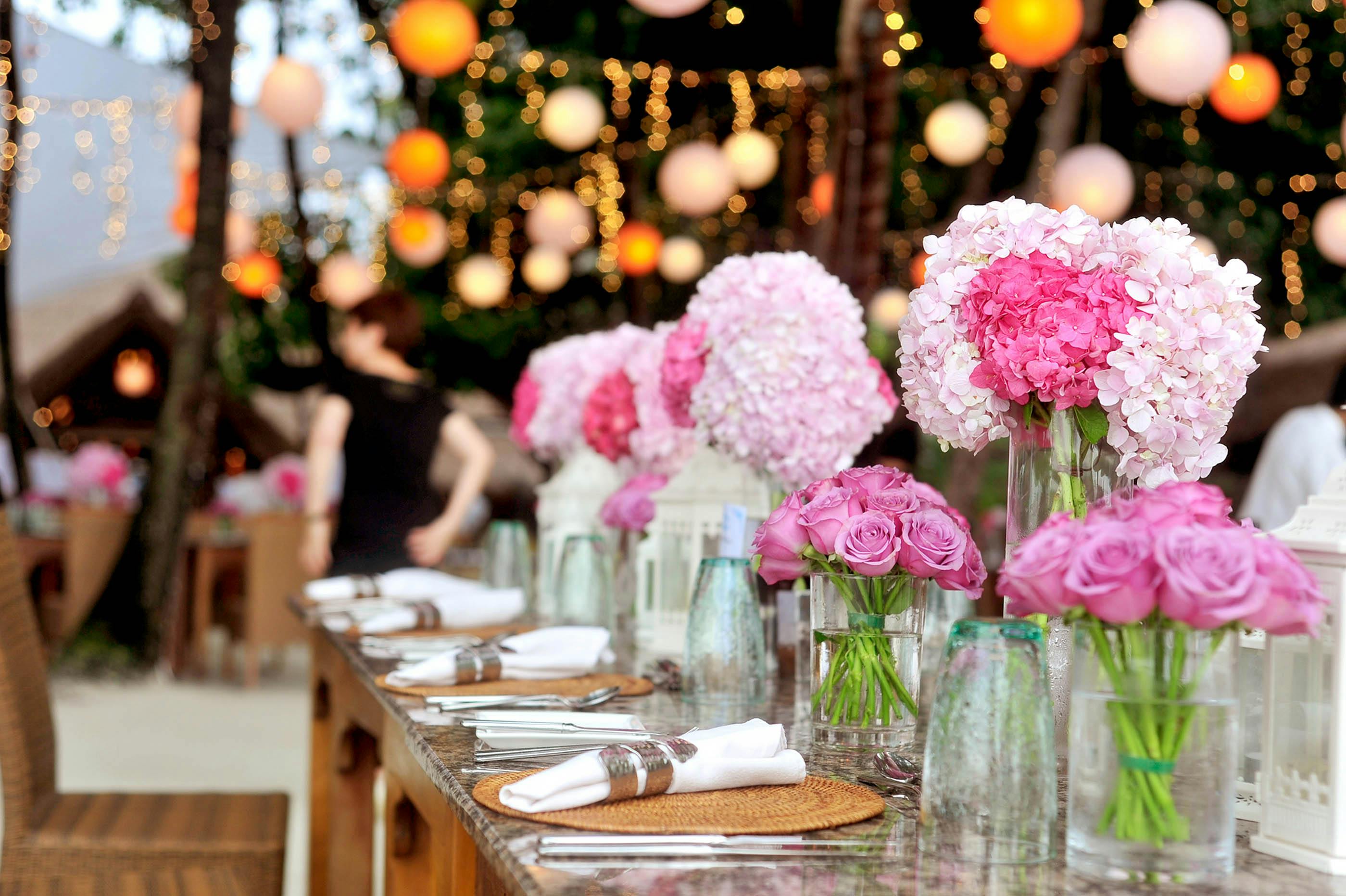 A venue decorated with flowers and table settings | Source: Pexels