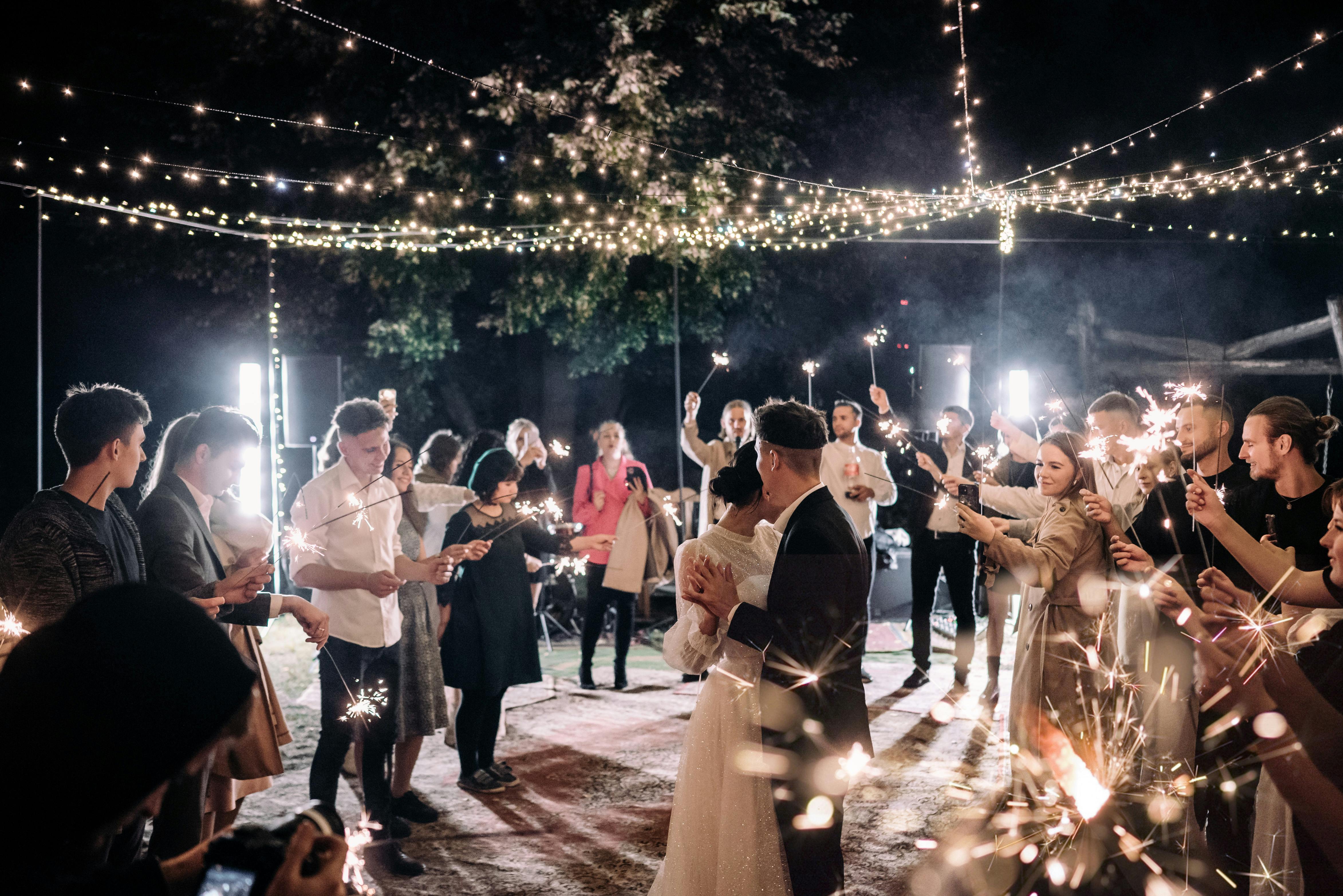 Wedding guests dance the night away with the bridal couple | Source: Pexels