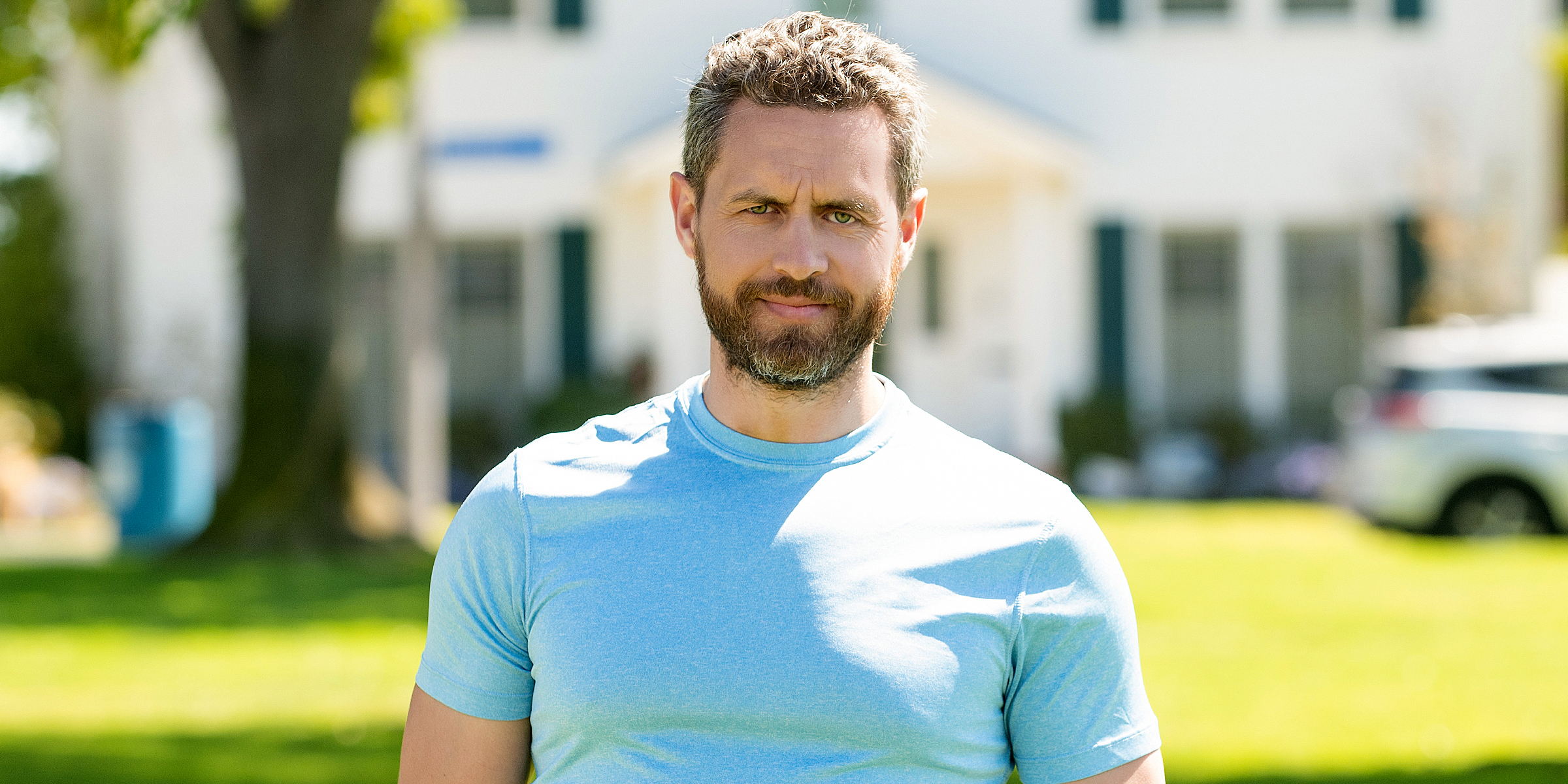 A man standing in front of a house | Source: Shutterstock