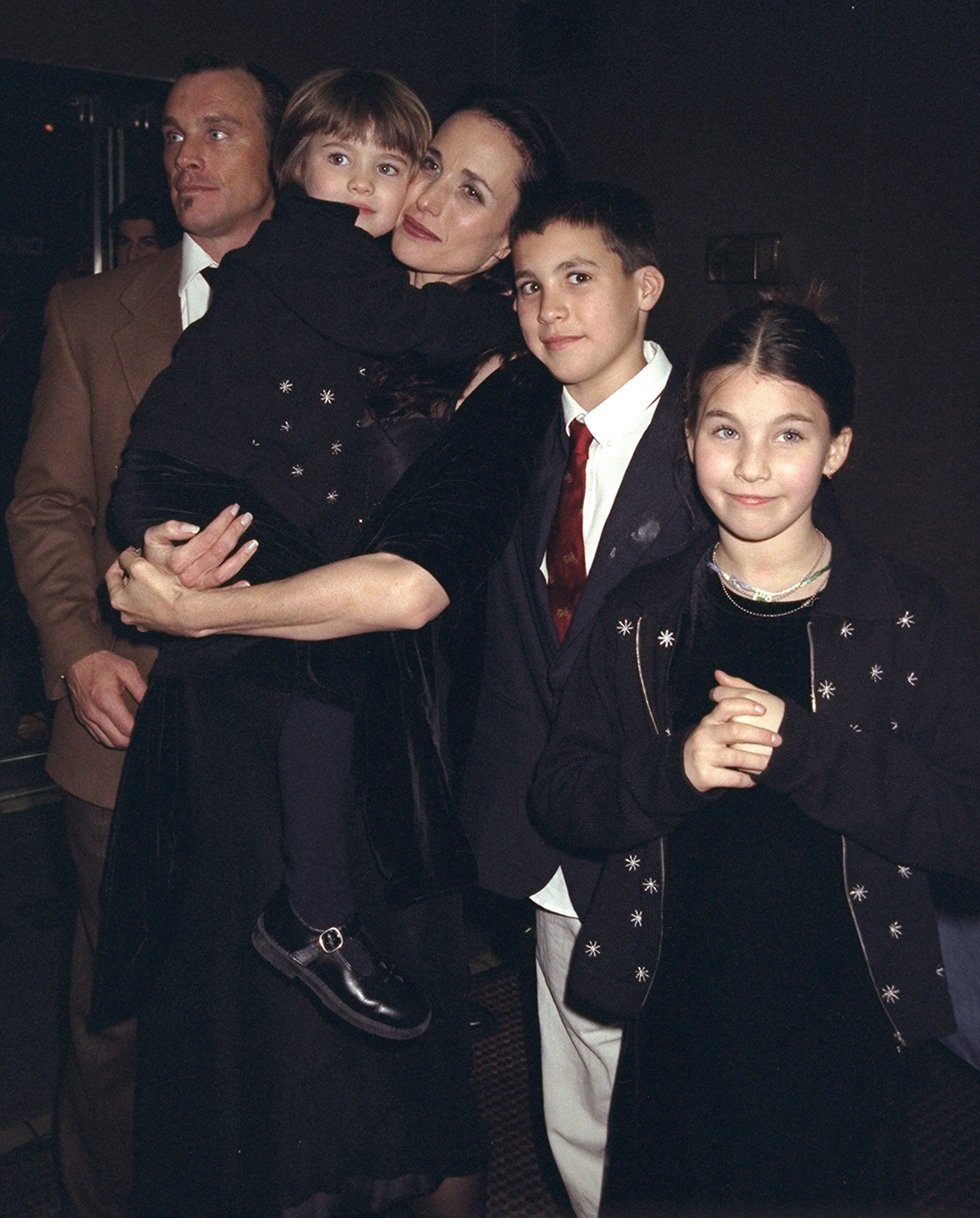 Andie MacDowell and husband Paul Qualley with family at the premiere of "Just the Ticket" at Cinema 2 on February 18, 1999 in New York | Source: Getty Images 