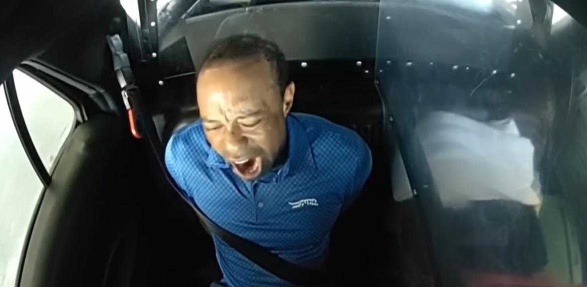 Tiger Woods yawning inside the patrol car, as seen in a video posted on April 2, 2026 | Source: YouTube/NBC News