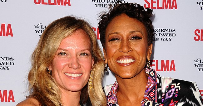 Amber Laign and Robin Roberts arrive on the red carpet for the "Selma" and the Legends Who Paved the Way gala on December 6, 2014. | Photo: Getty Images