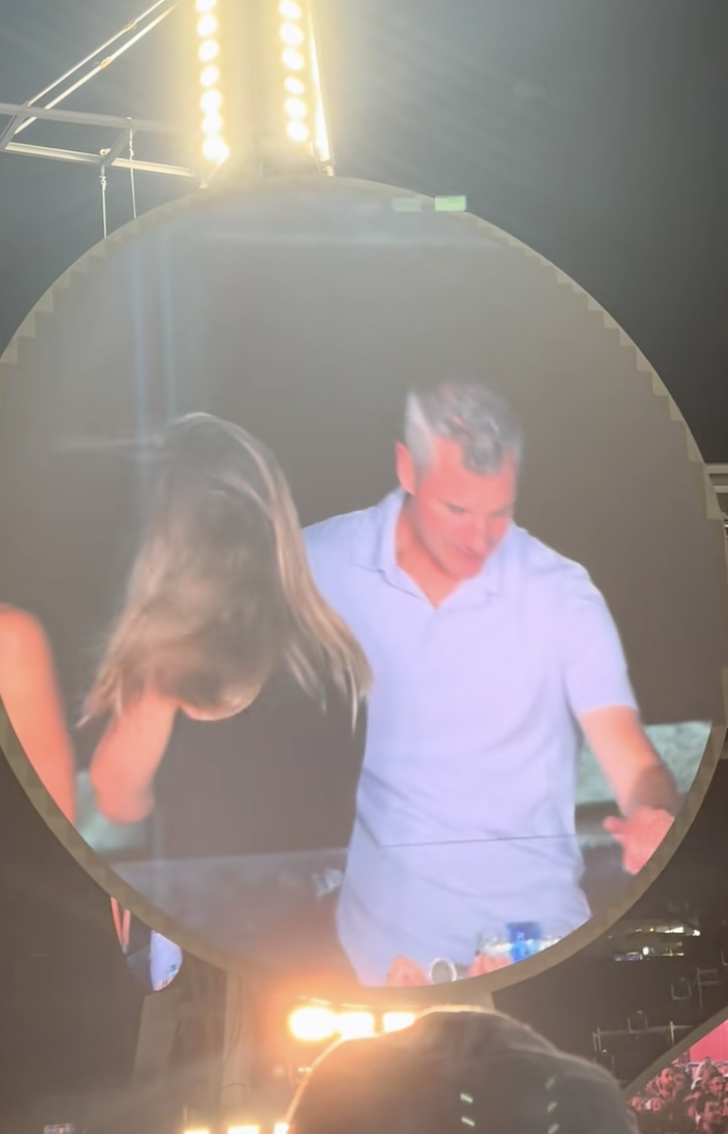 Kristin Cabot turns her back on the camera as Andy Byron prepares to duck down during the Coldplay concert in Boston on July 16, 2025 | Source: TikTok/@instaagraace