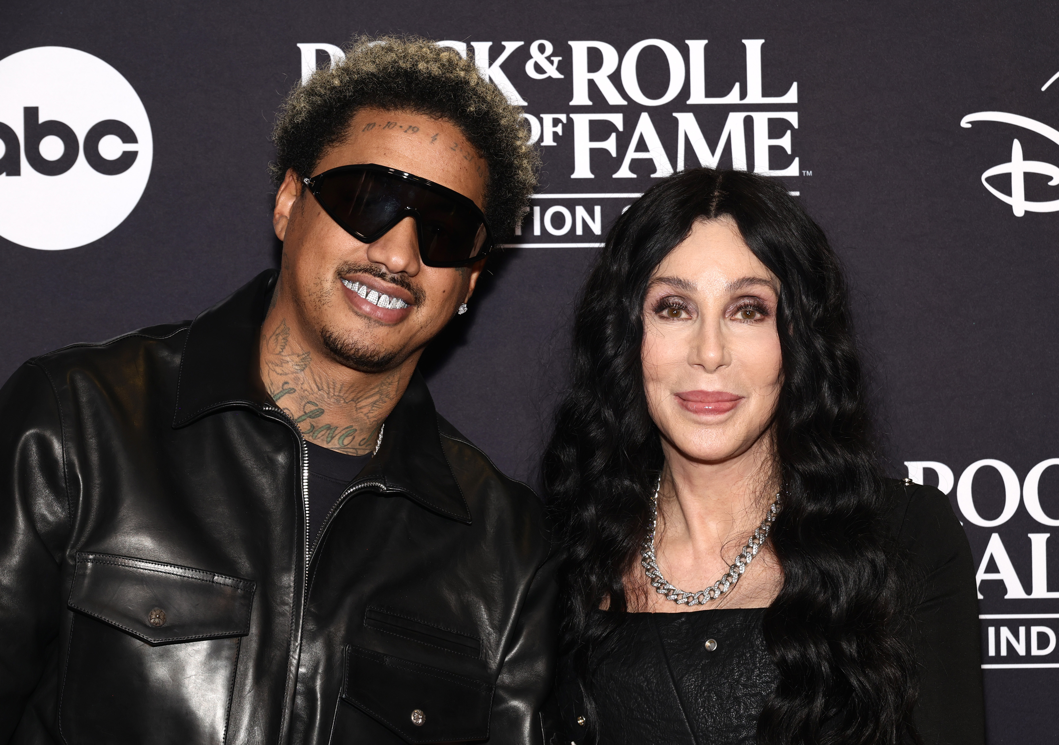 Cher and Alexander “AE” Edwards attend the Rock & Roll Hall of Fame Induction Ceremony in Cleveland, Ohio on October 19, 2024. | Source: Getty Images