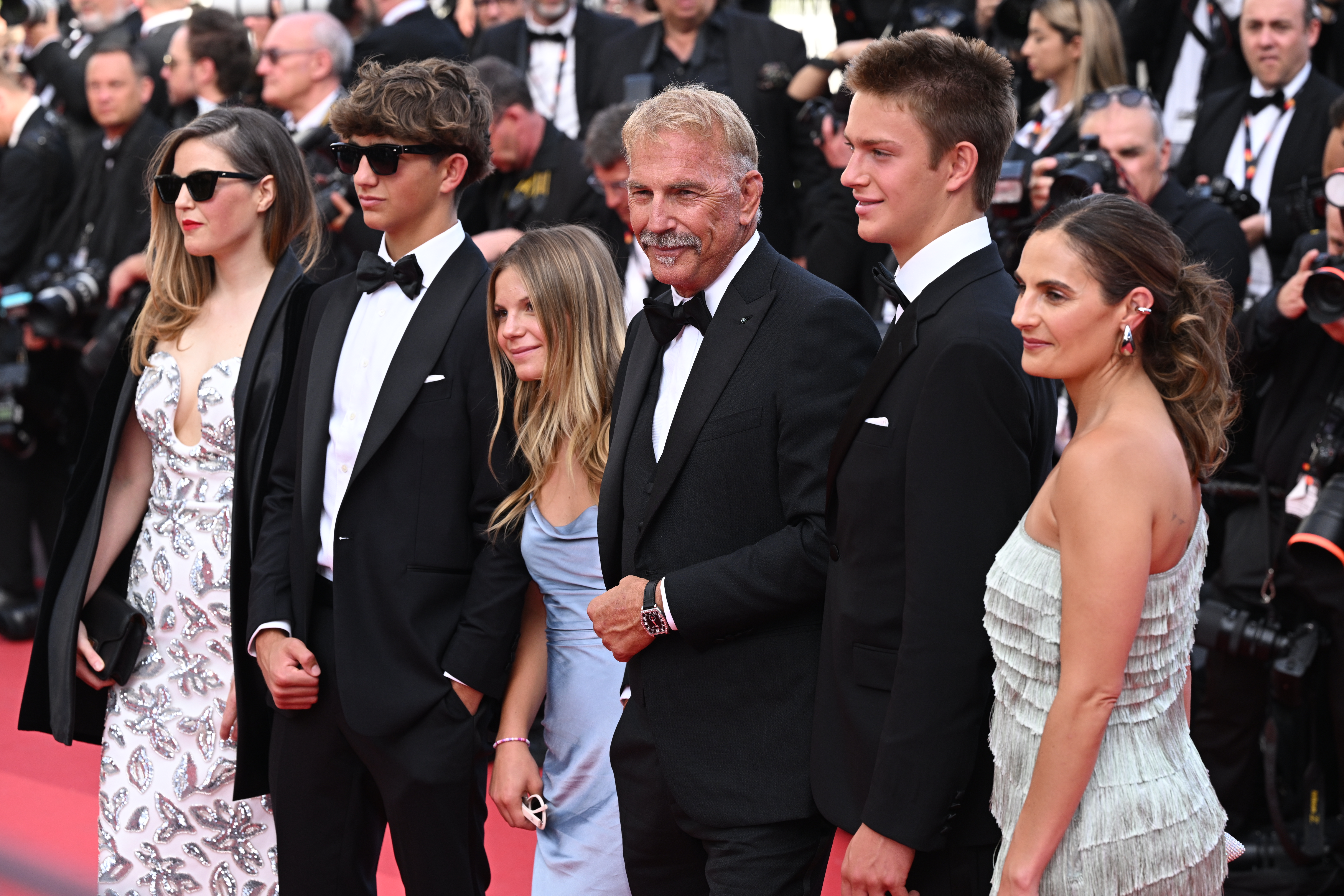 Kevin Costner with his children Annie, Cayden, Grace, Hayes and Lily Costner at the Cannes Film Festival in Cannes, France on May 19, 2024 | Source: Getty Images