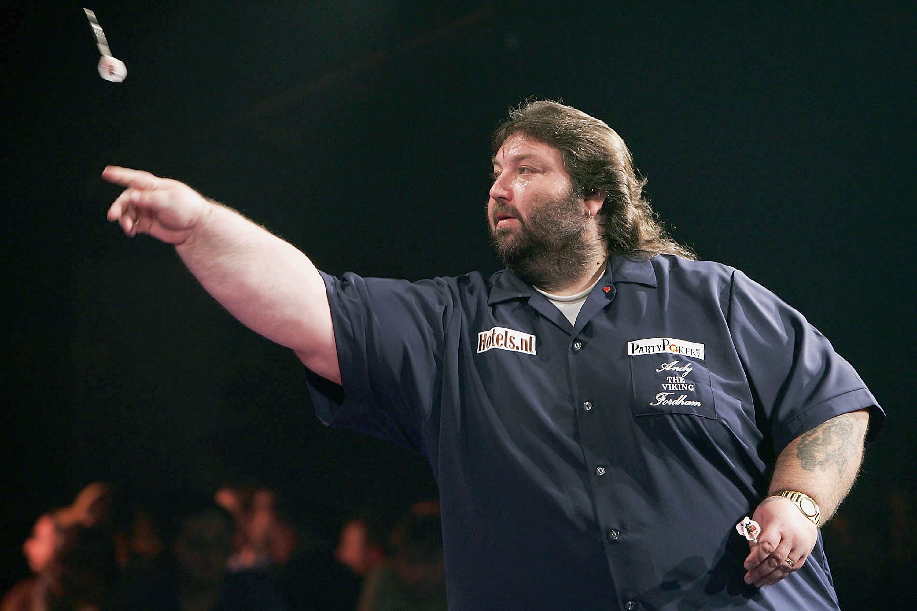 Andy Fordham in action during the Showdown match between Phil Taylor and Andy Fordham at The Circus Tavern on November 21, 2004 in Purfleet, England. | Source: Getty Images