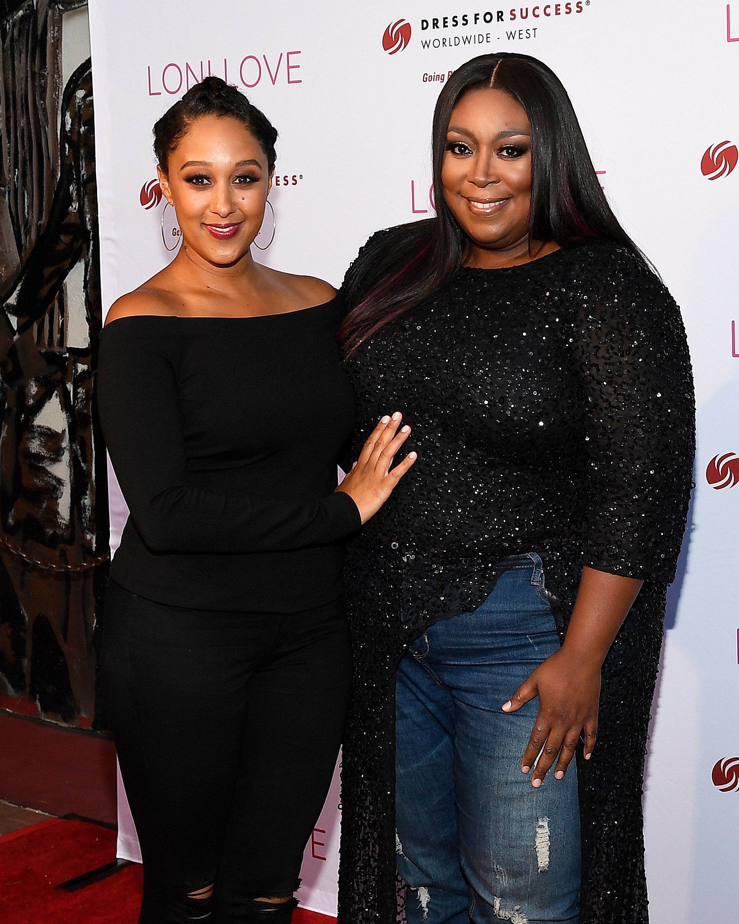 The Real" co-hosts Tamera Mowry (L) and Loni Love attend Loni Love's Birthday Roast benefiting the Dress For Success charity at Hollywood Improv on July 12, 2017 in Hollywood, California. | Photo: Getty Images